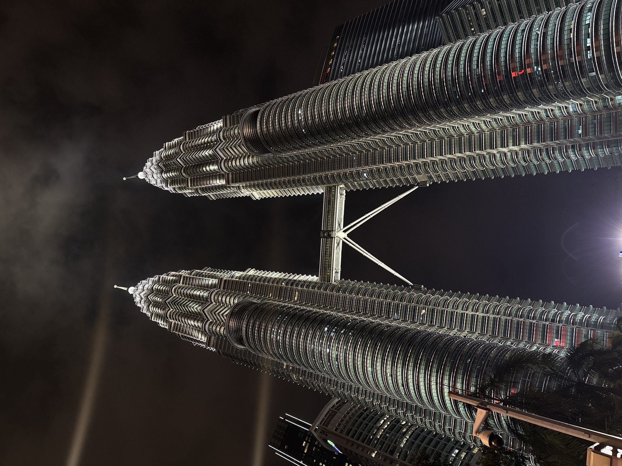 Night photography session captures illuminated Petronas Twin Towers in Kuala Lumpur