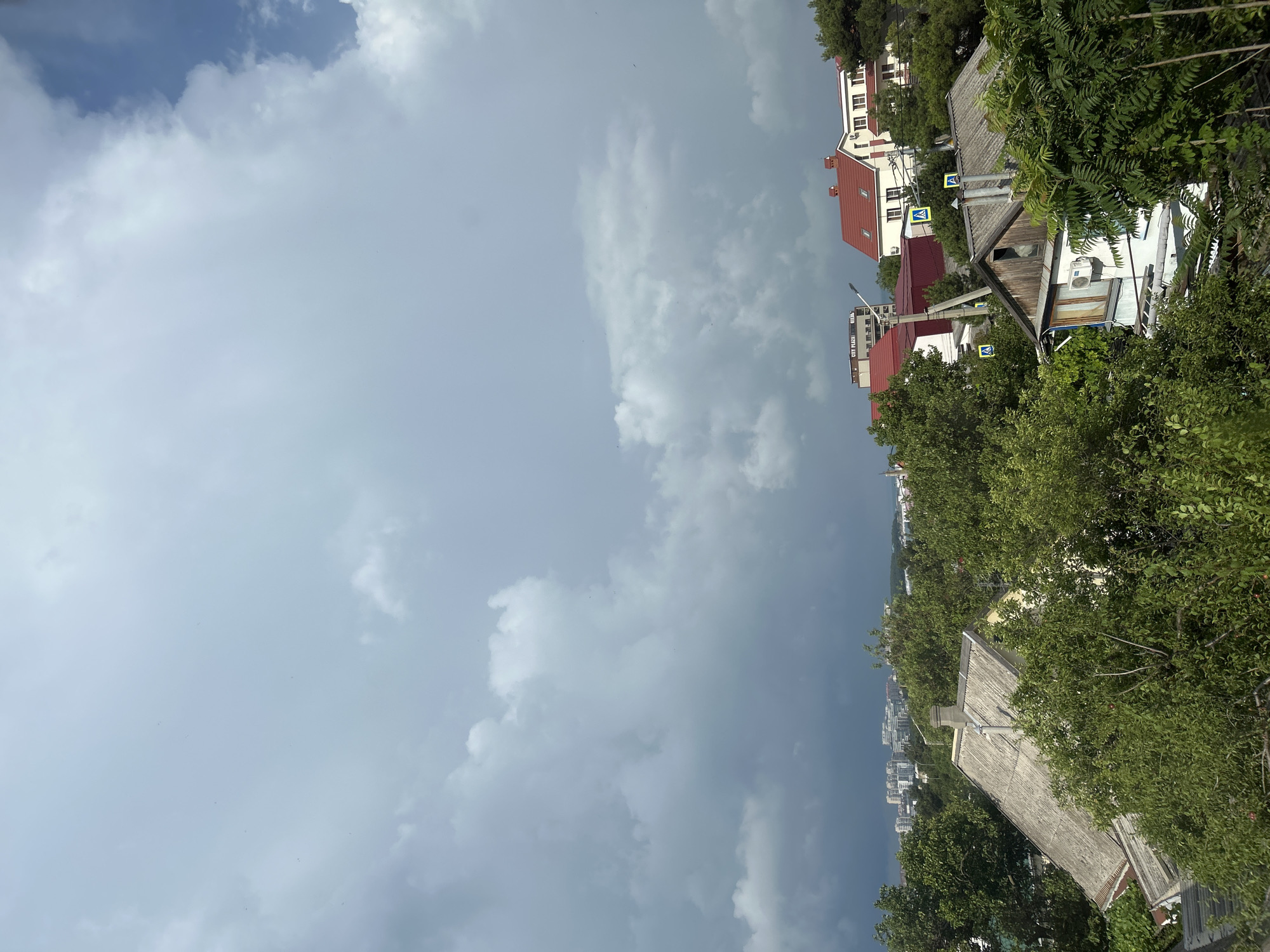 Storm clouds gather over Gelendzhik as life continues indoors