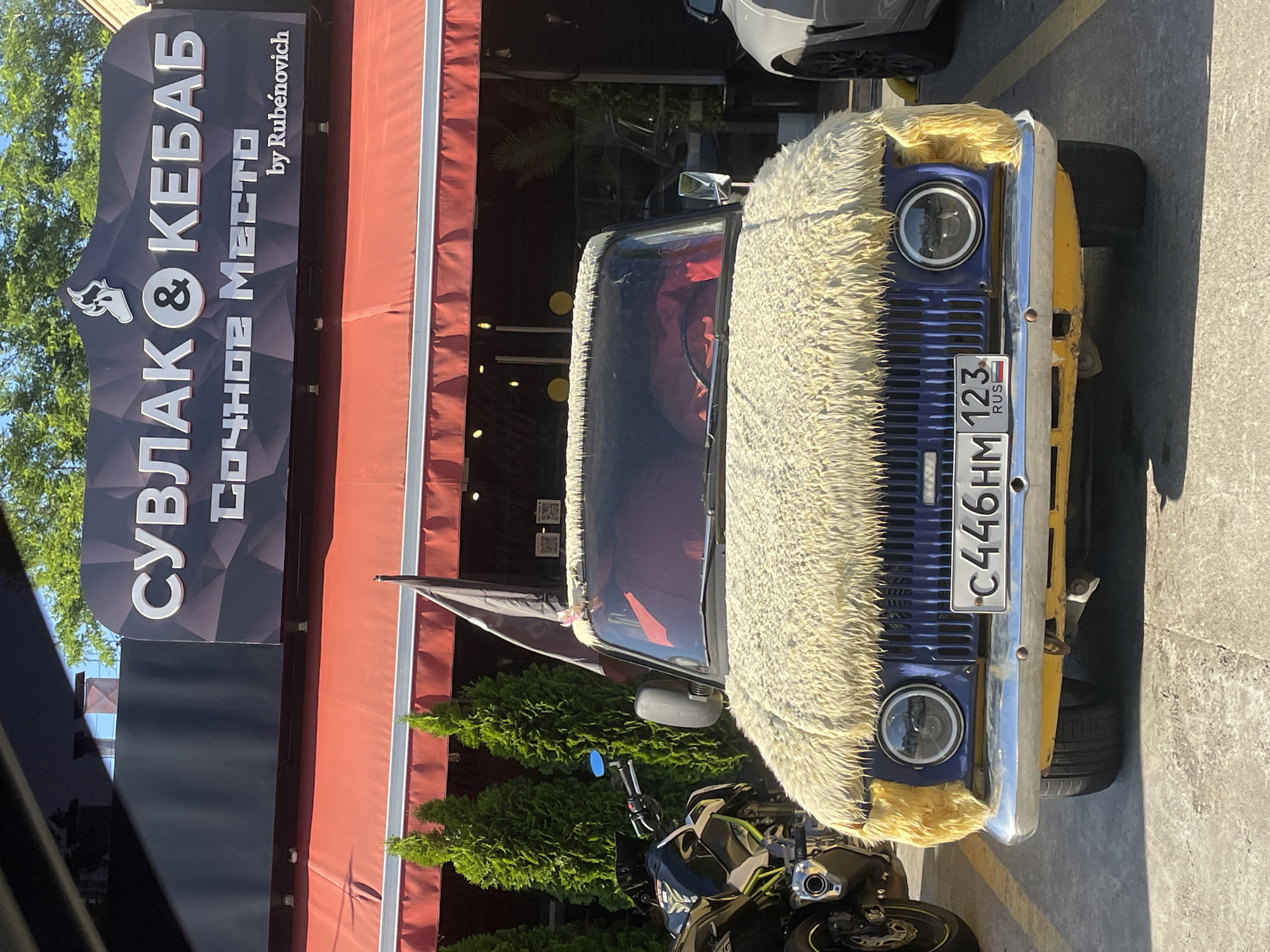 Folk performance and a furry novelty car in Sochi