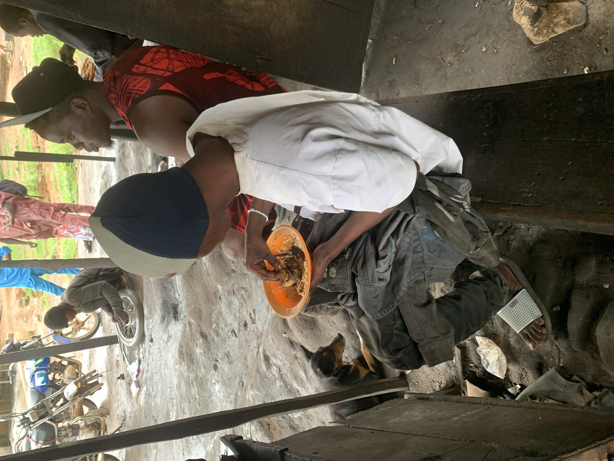 Everyday street life along a rainy Shagamu roadside