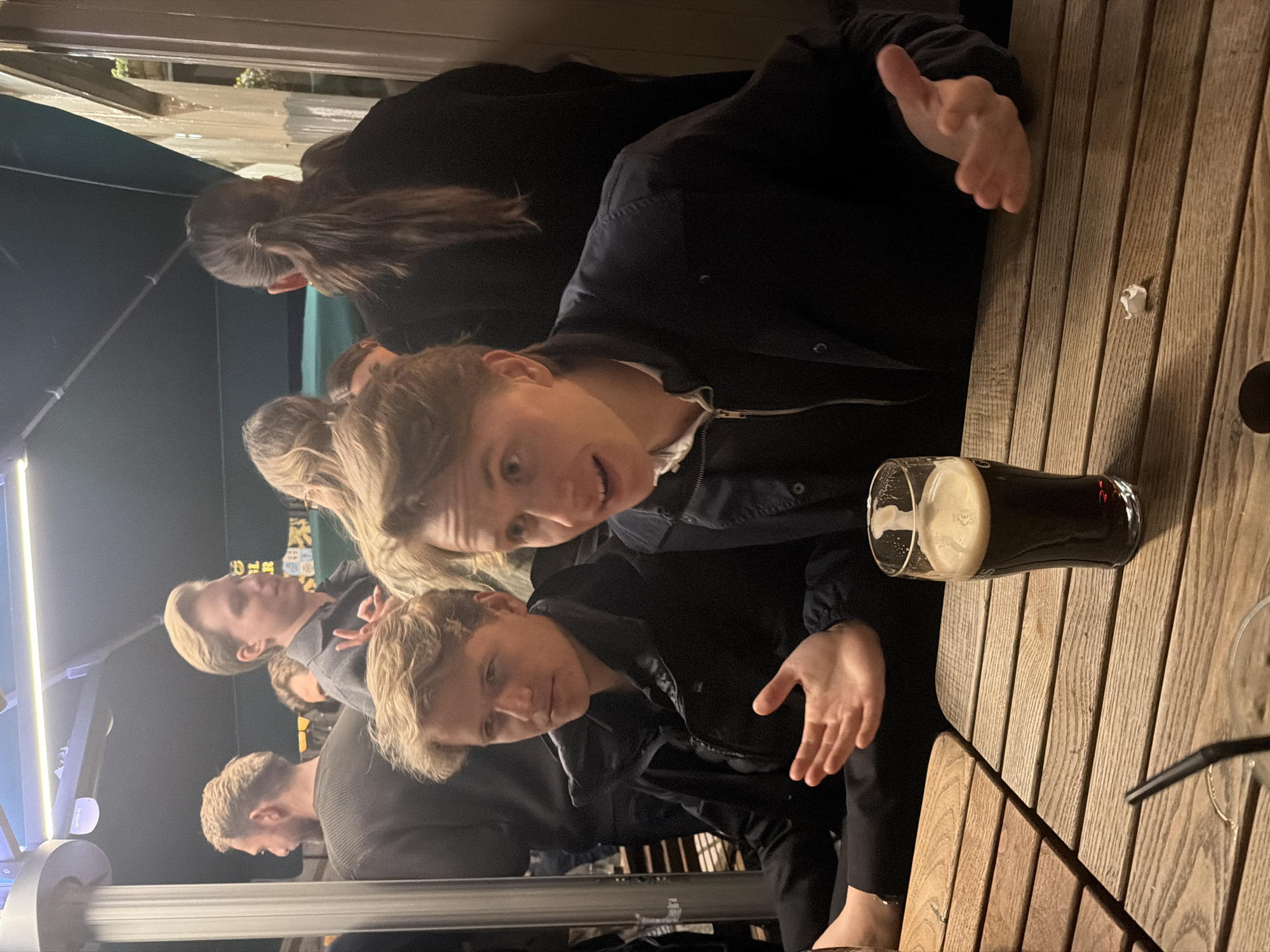 Evening social gathering at historic London pub documented by witnesses