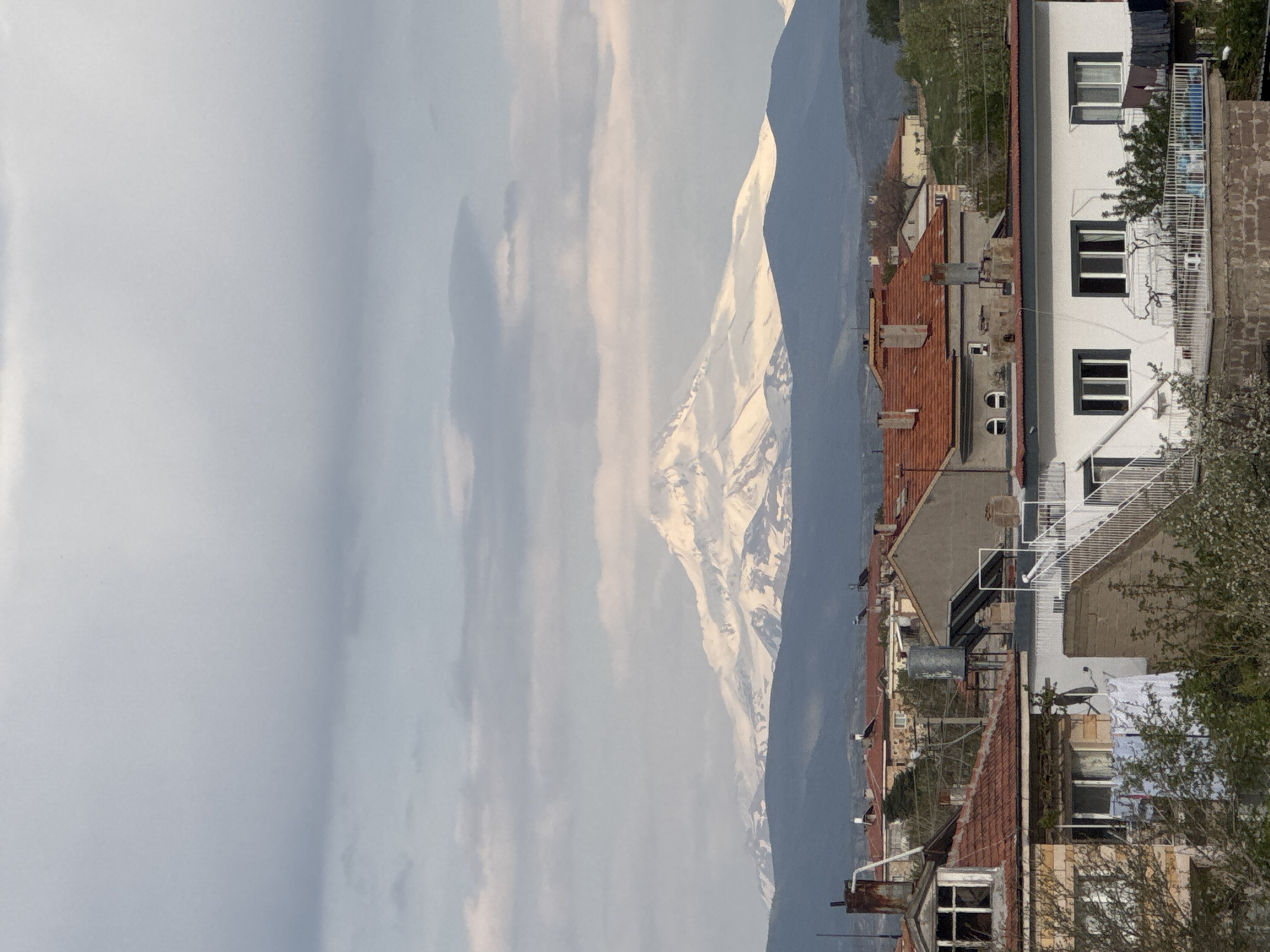 Witness captures Ürgüp townscape with snow-capped mountain backdrop