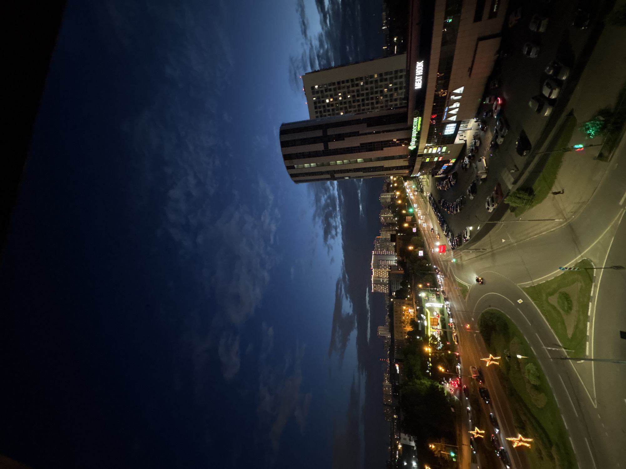 Pushkino at dusk: intersections, apartment blocks, and nightfall