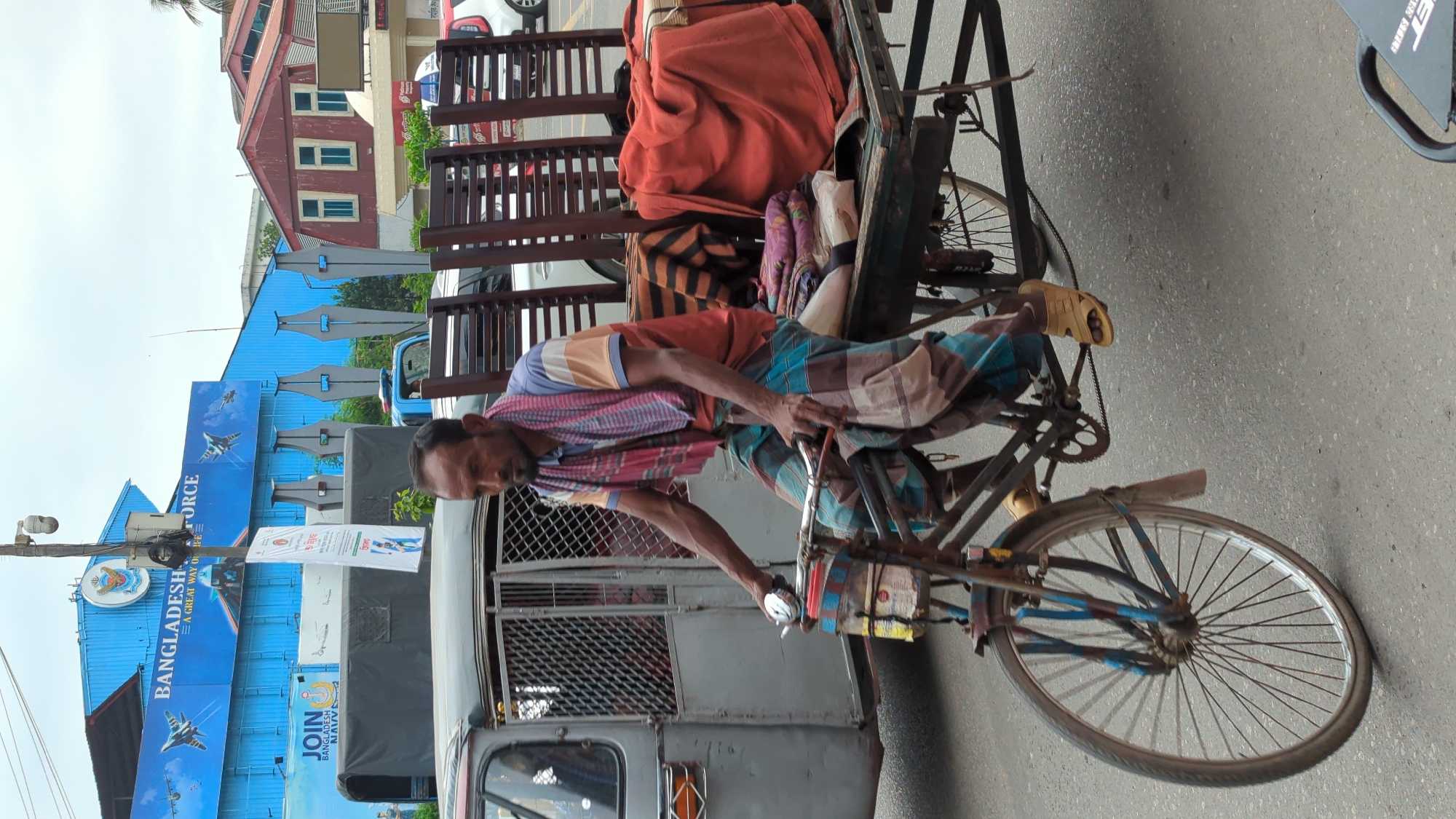 Morning street life documented in Dhaka intersection