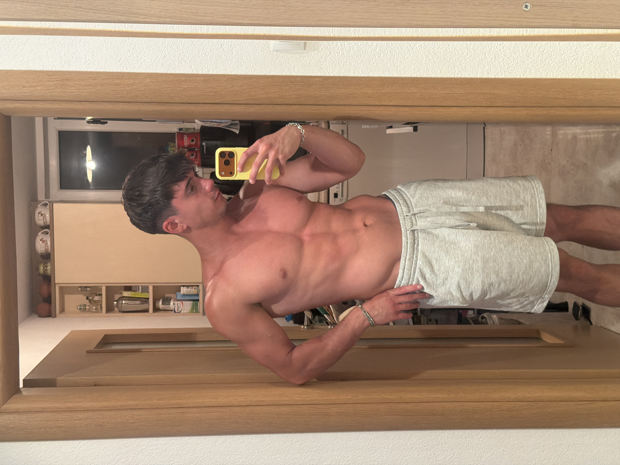 Mirror selfie with yellow phone in Blagoevgrad interior