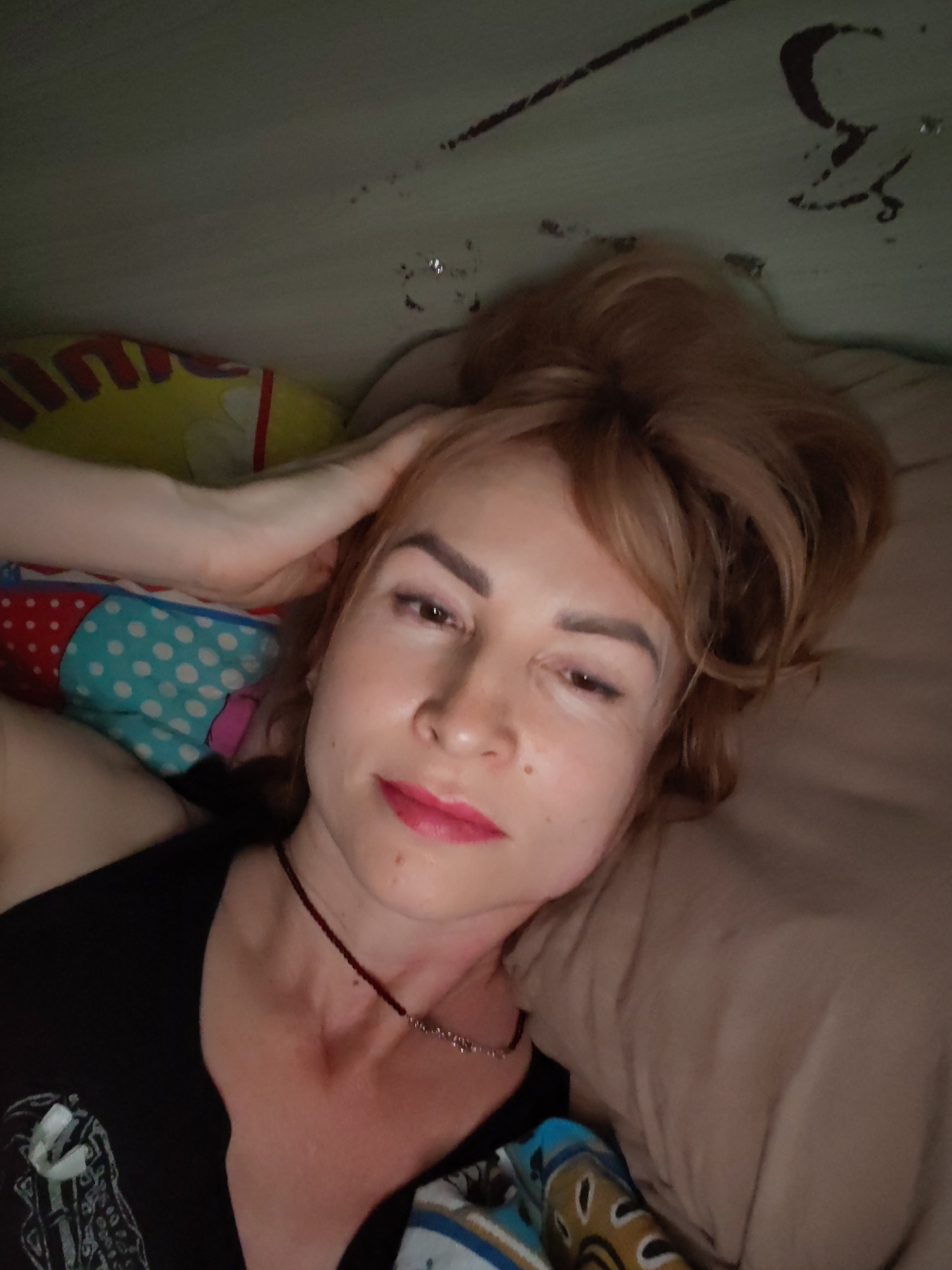 Woman resting on bed observed in Chaikovsky, Russia