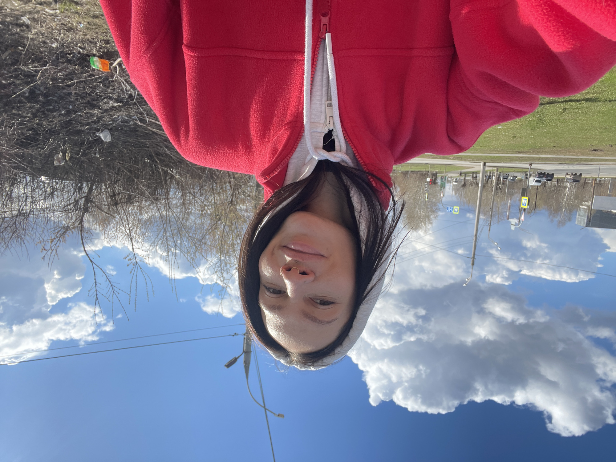 Woman takes morning selfies under cloudy sky in Izhevsk