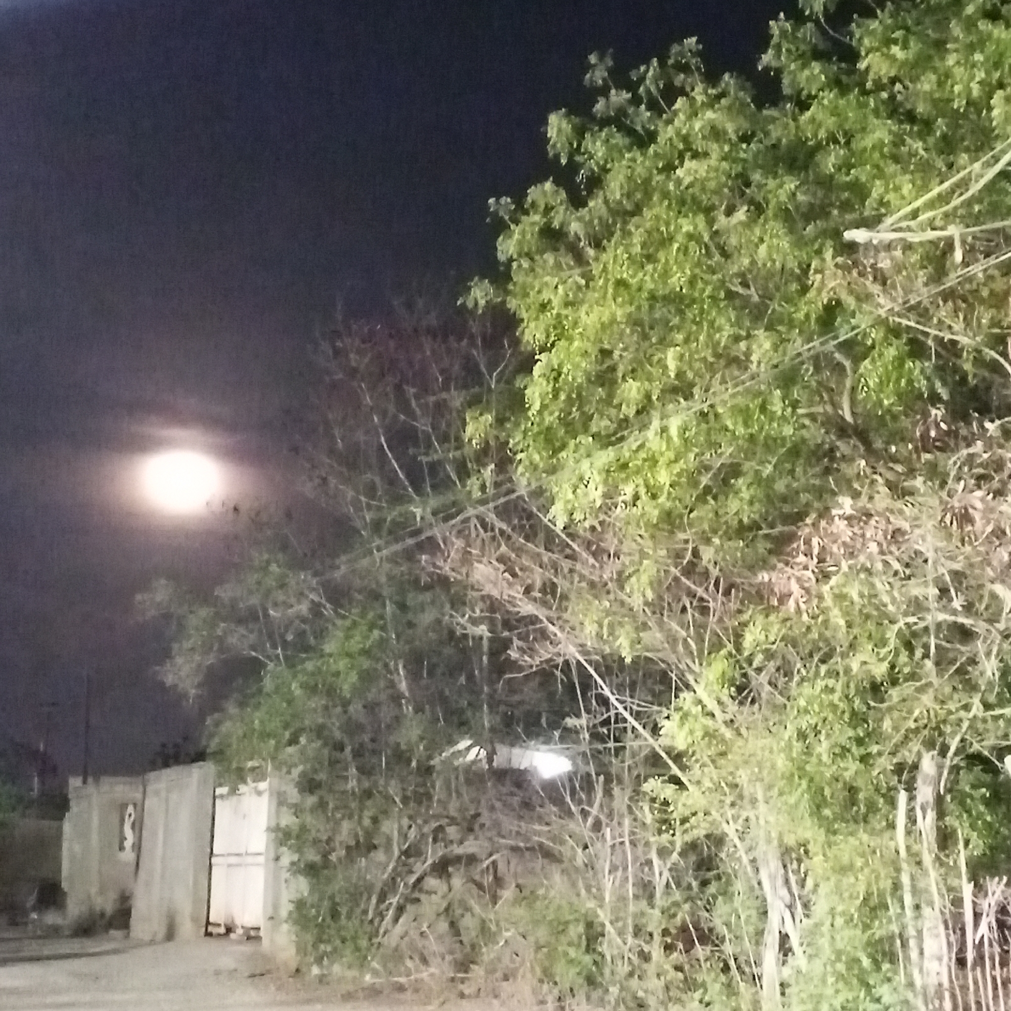 Full moon illuminates Altagracia, Venezuela during late night hours