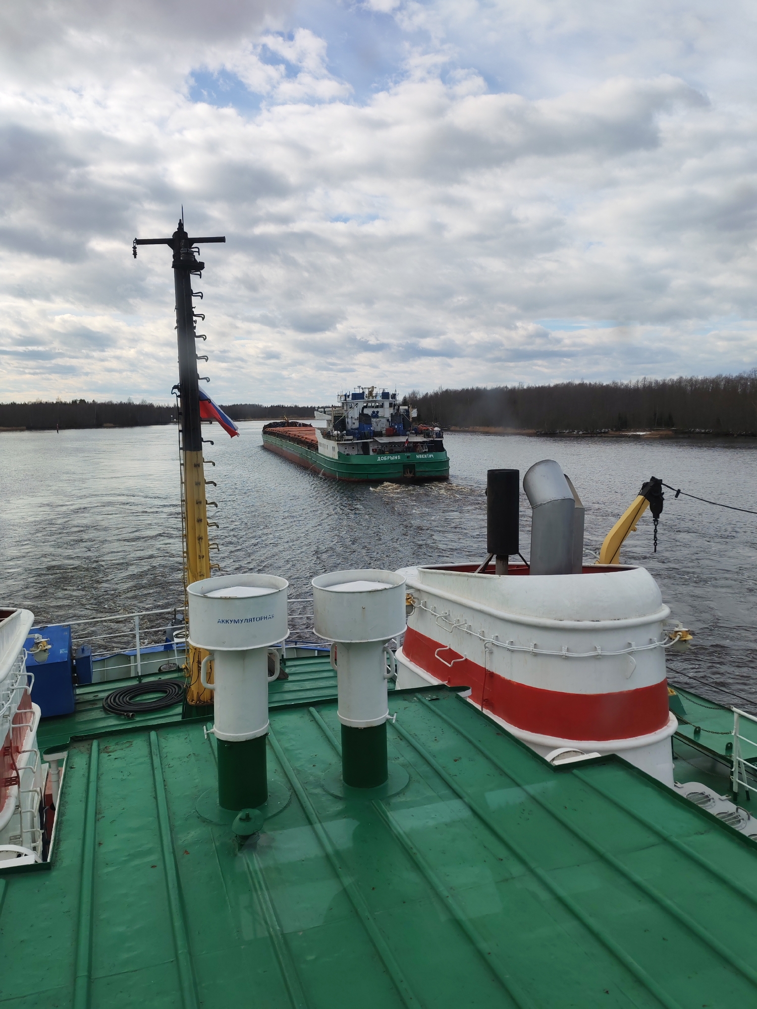 Cargo ship navigates Russian waterway near Novokemskii