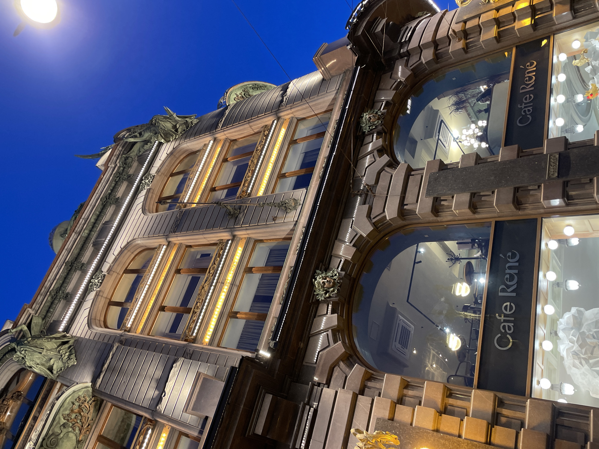Ornate illuminated building photographed at night in Saint Petersburg