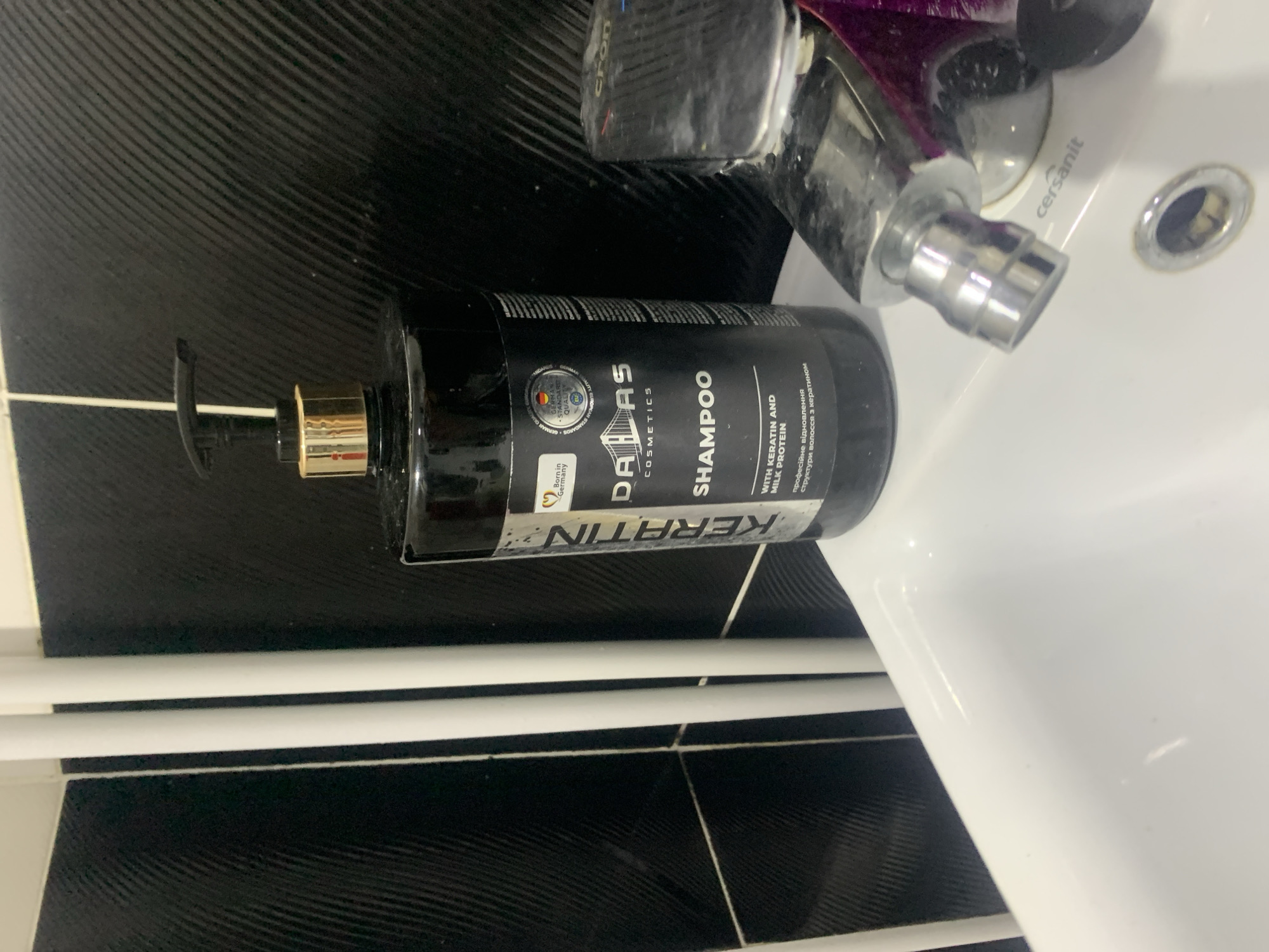 Personal items around a home desk and bathroom in Glodeni