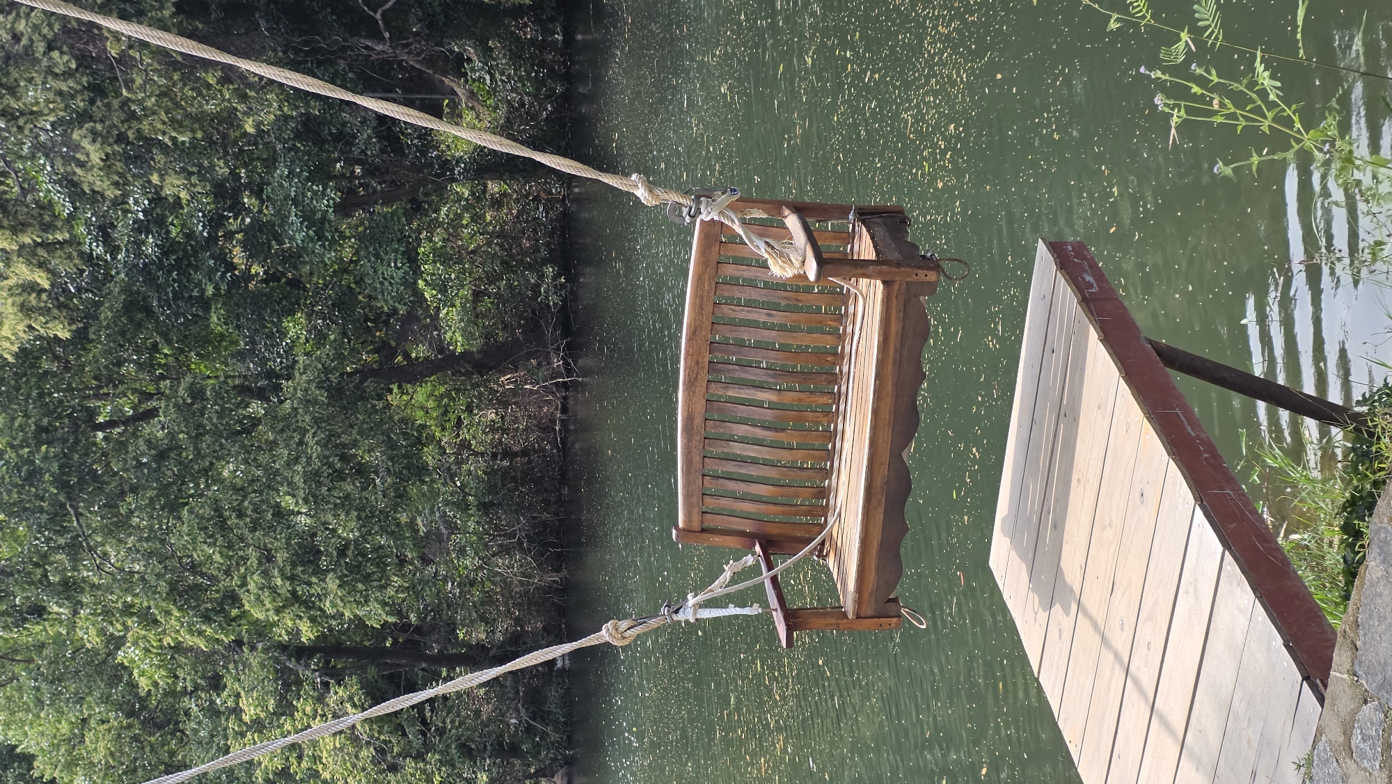 Lakeside swing scene captured in Nam Ninh Hoa, Vietnam