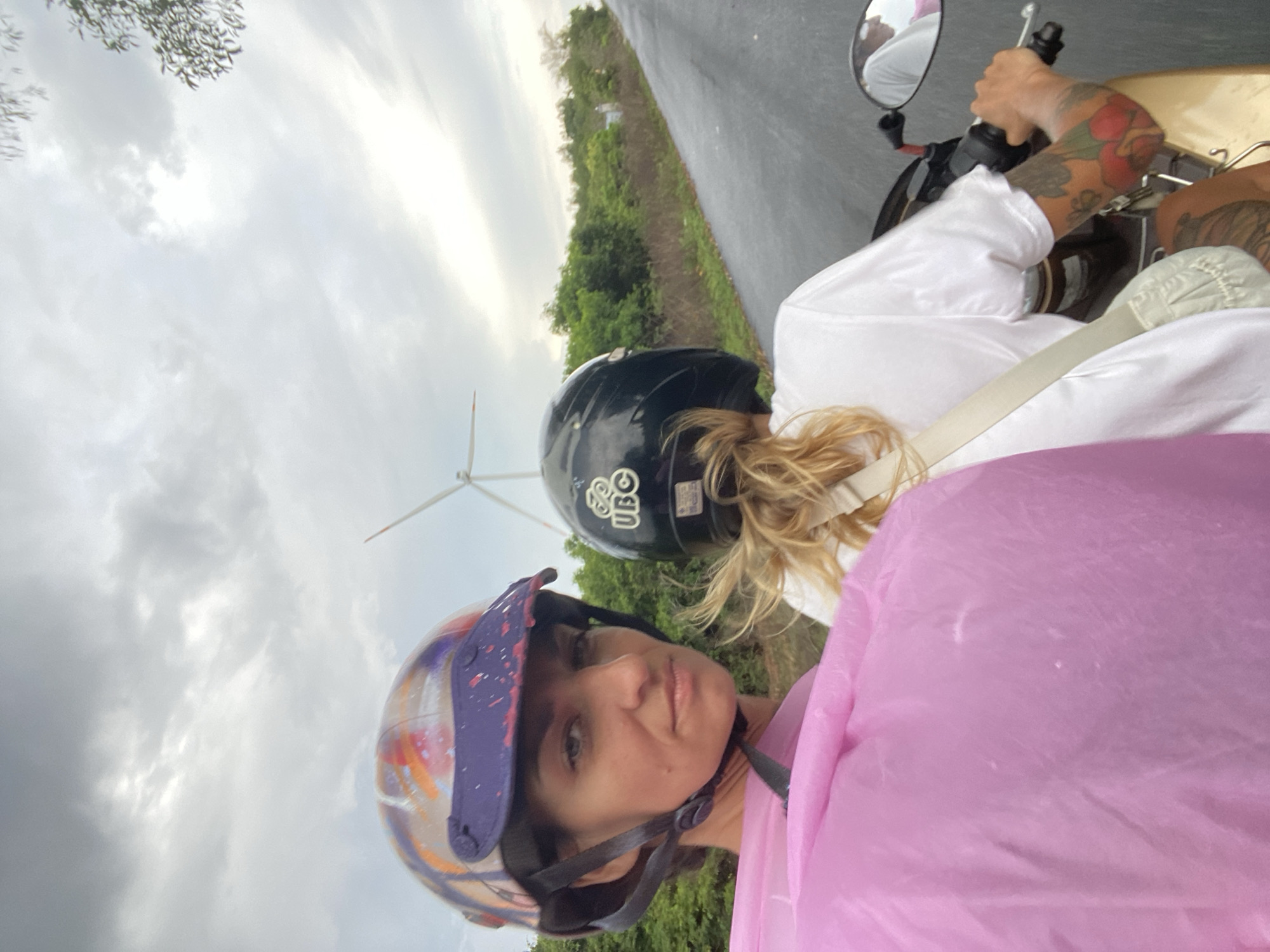 Two women visit Mui Ne wind farms by motorcycle