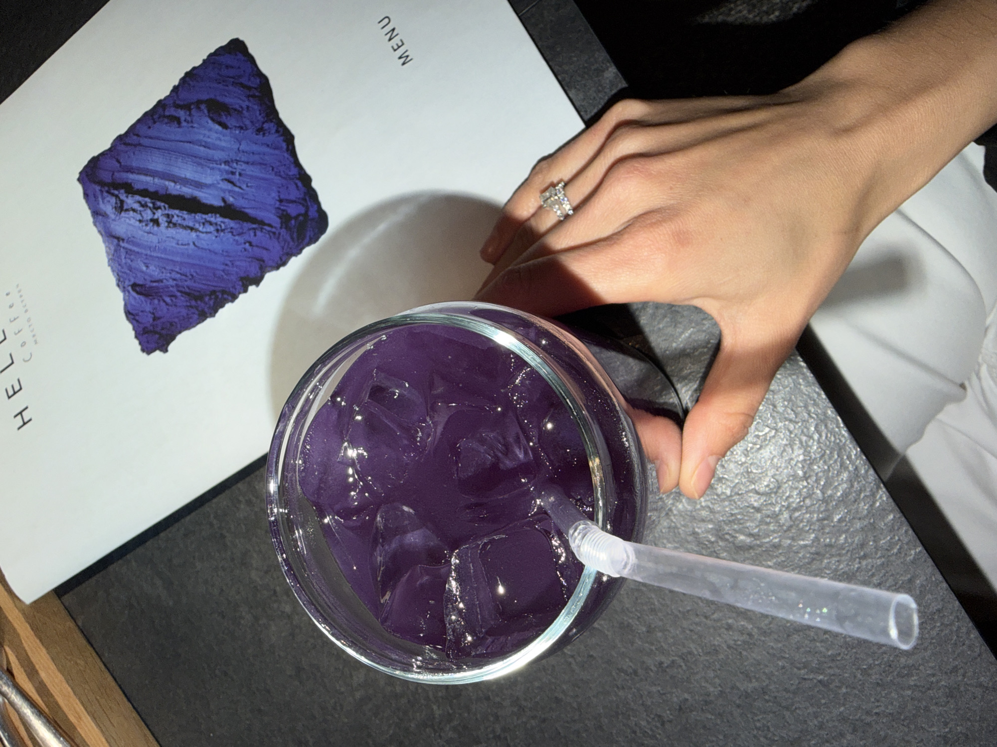 Woman browses menu at Krasnoyarsk cafe