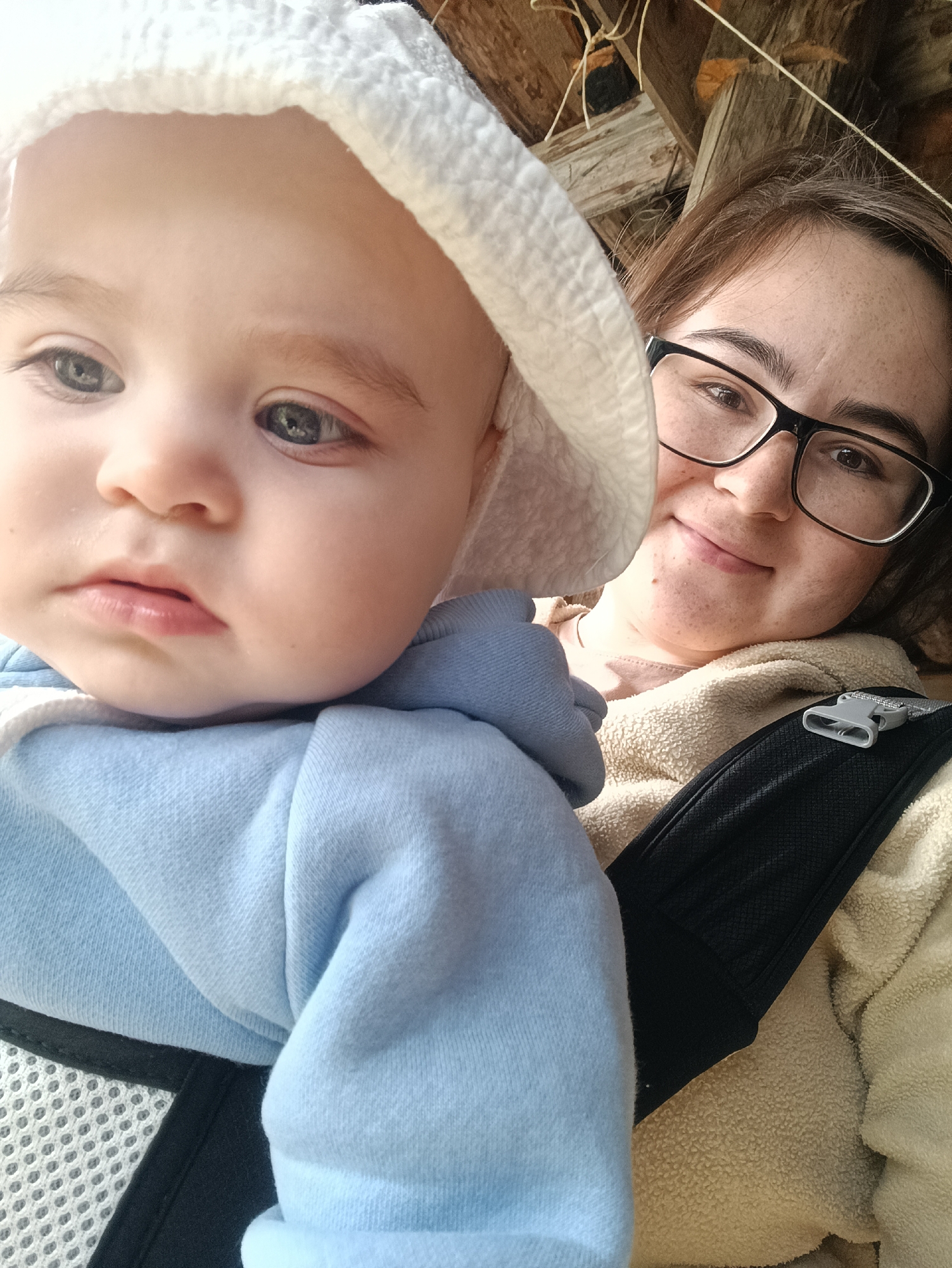 Mother and baby enjoy outdoor time in Russian village