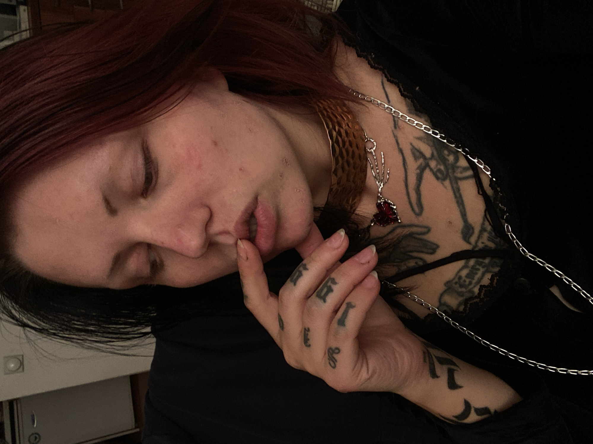 Indoor portrait captured of person in black lace-trimmed top