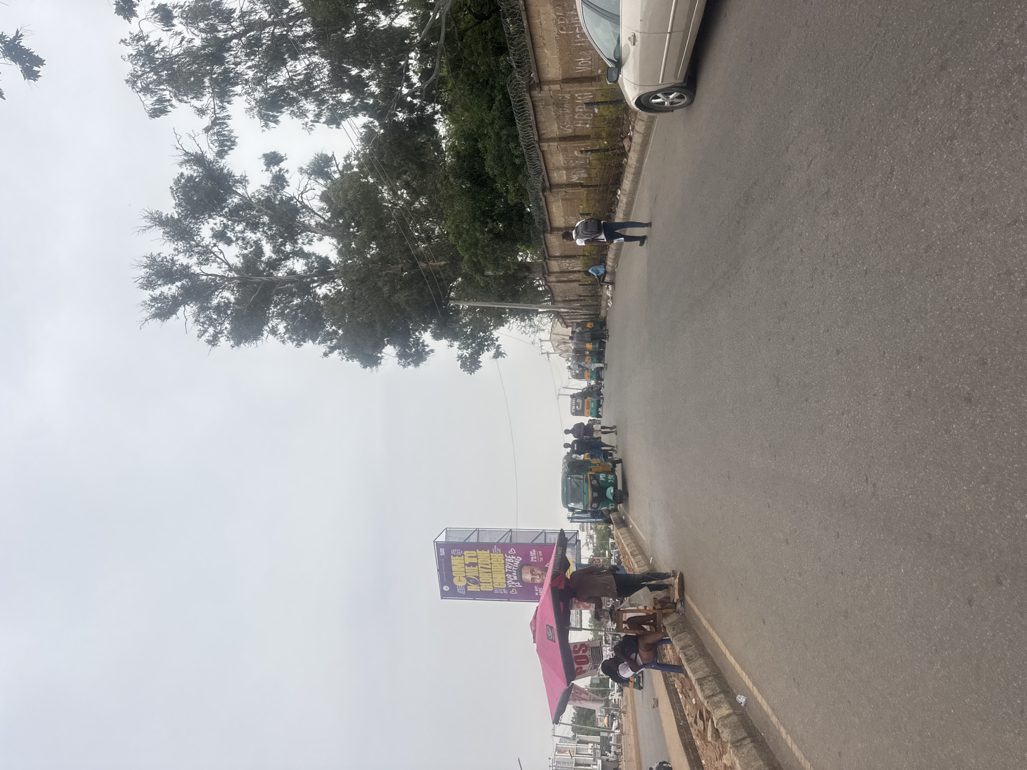 Street scene documented in Jos, Nigeria under overcast skies
