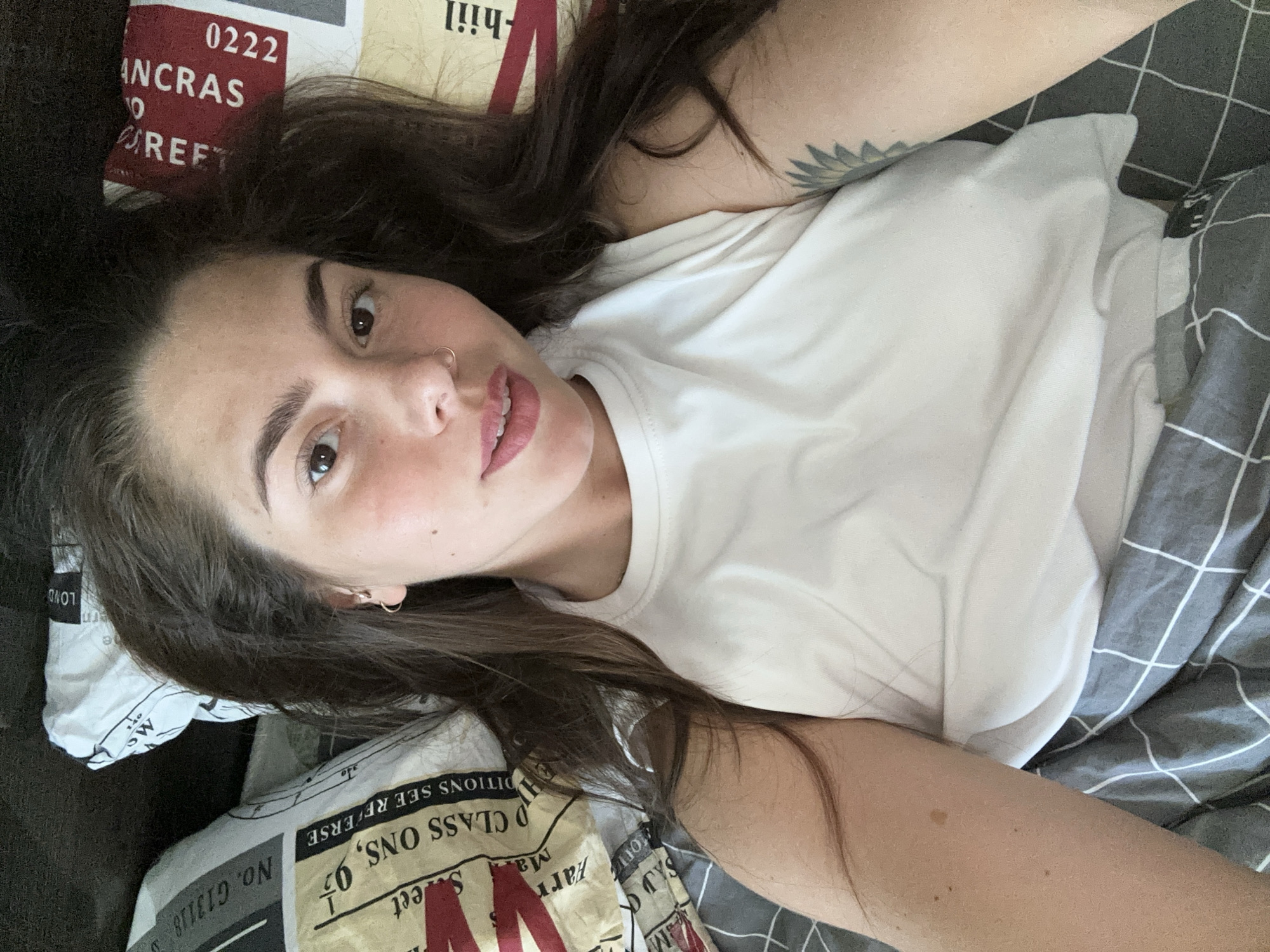 Woman rests in bed with unicorn plush in Reutov