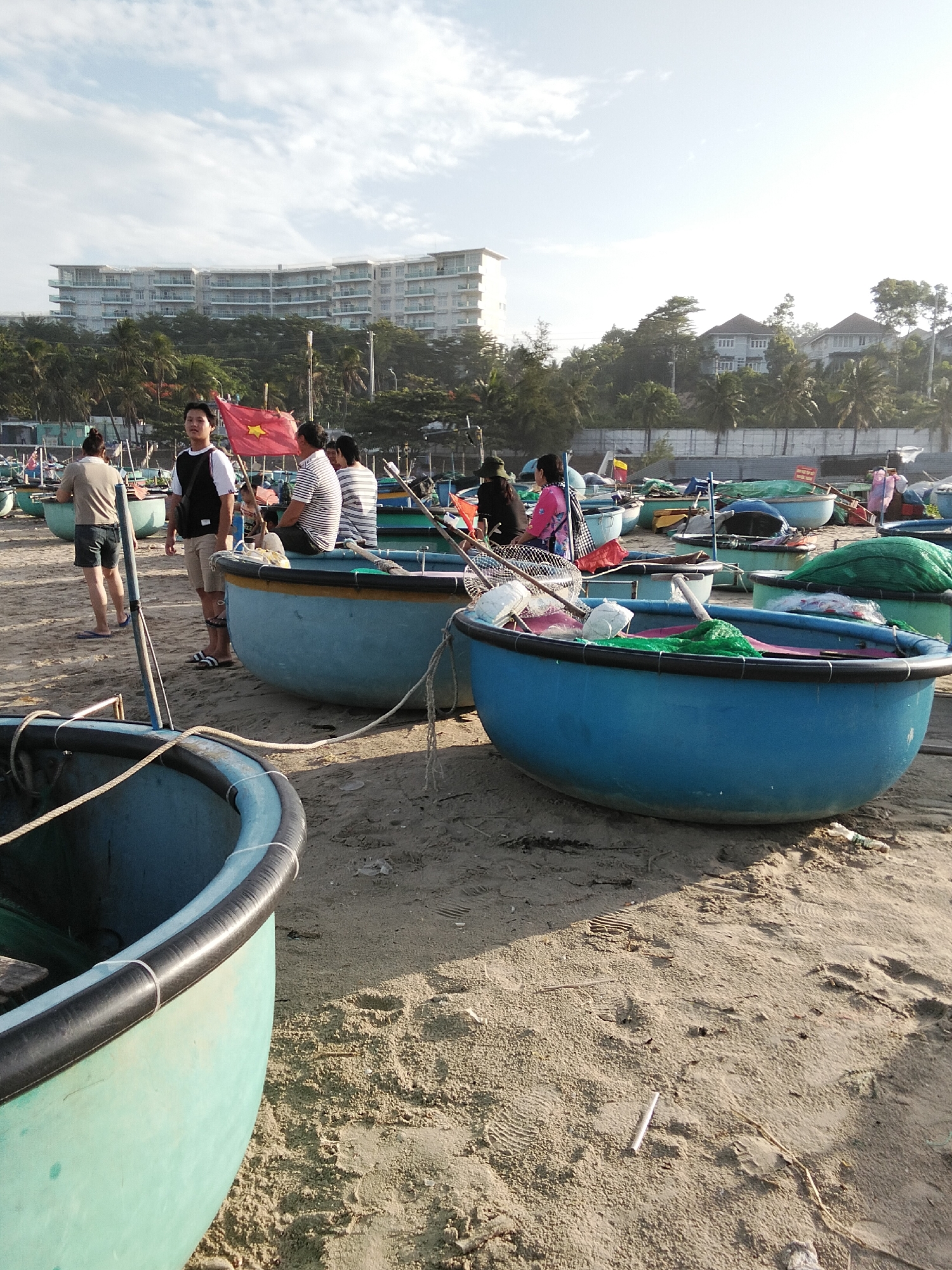 Beach basket boats and a spider on dim tiled floors