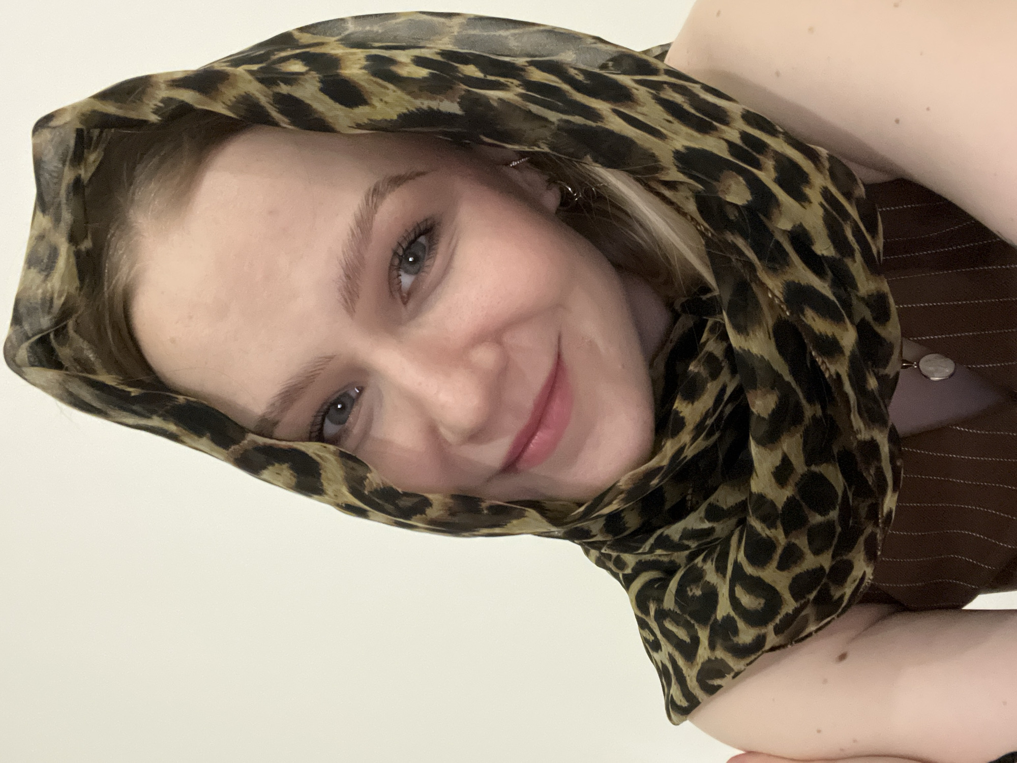 Woman in leopard scarf photographed indoors in Khimki