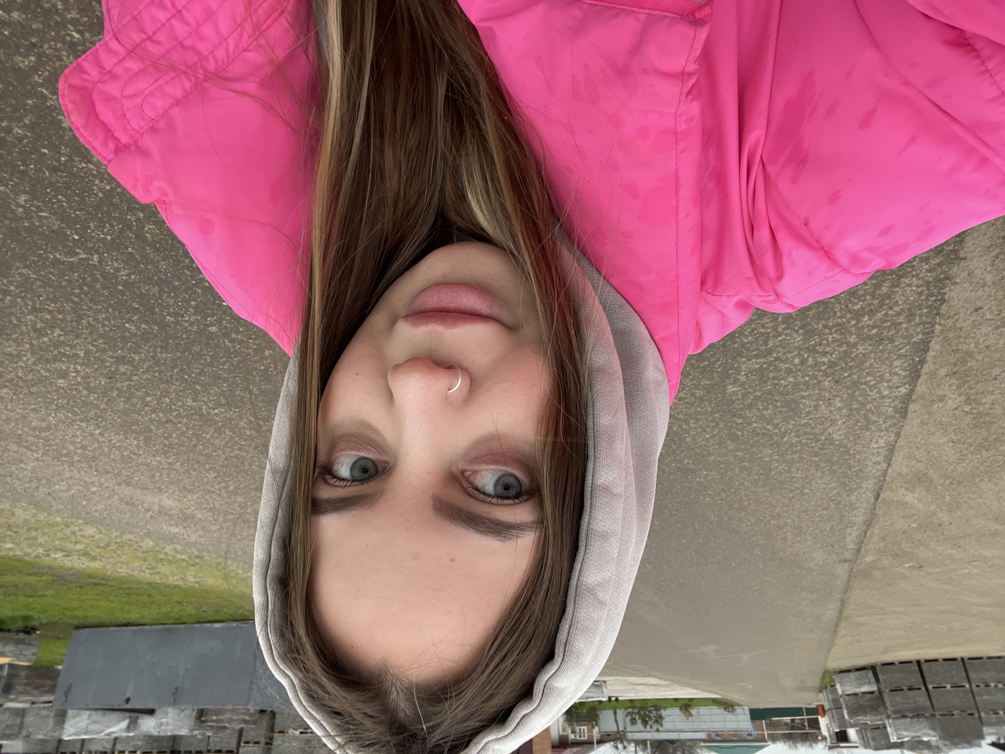 Woman takes selfies around Novopokrovskaya in pink jacket