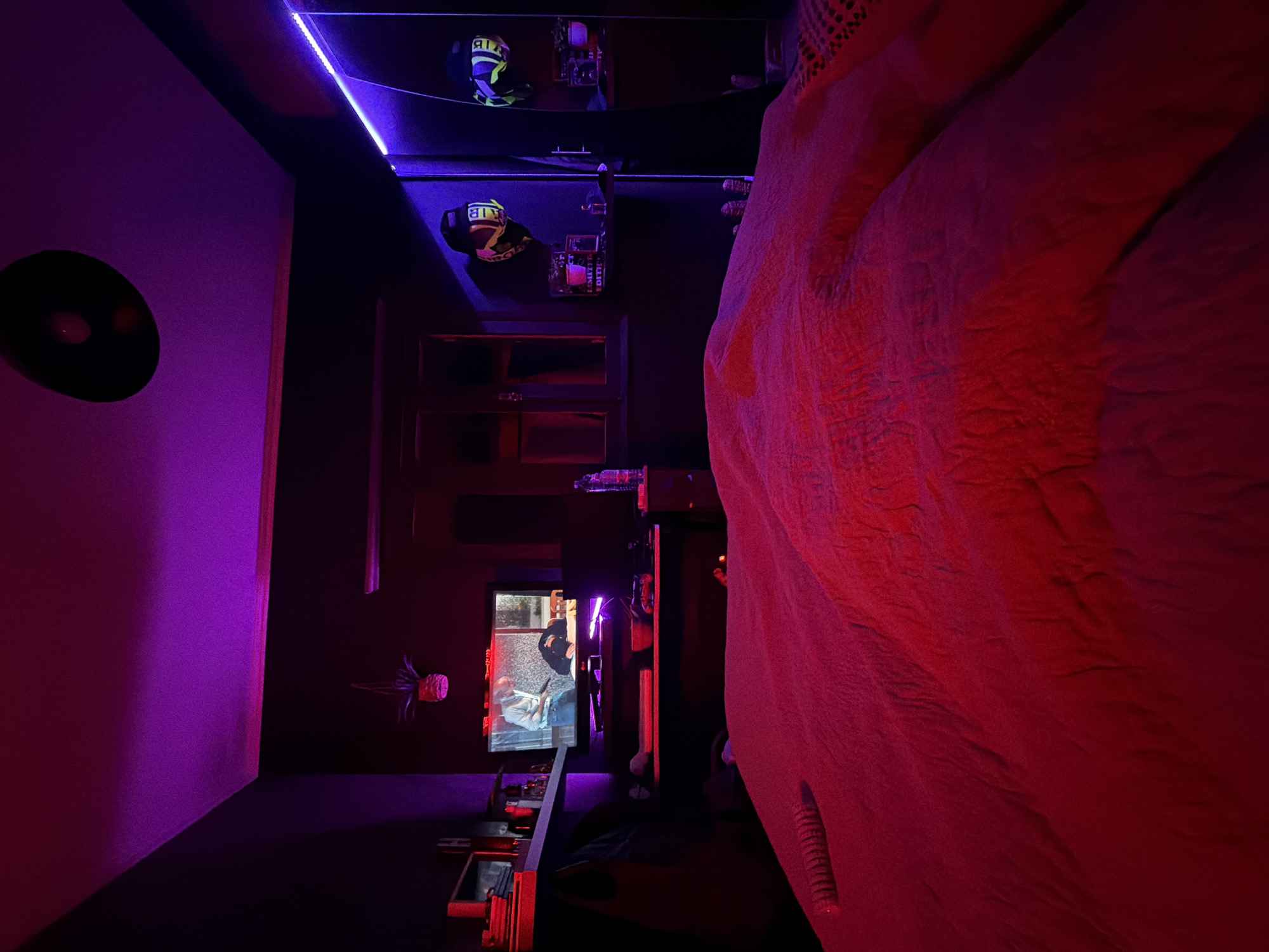 Bedroom documented with purple-red ambient lighting in Vila Real