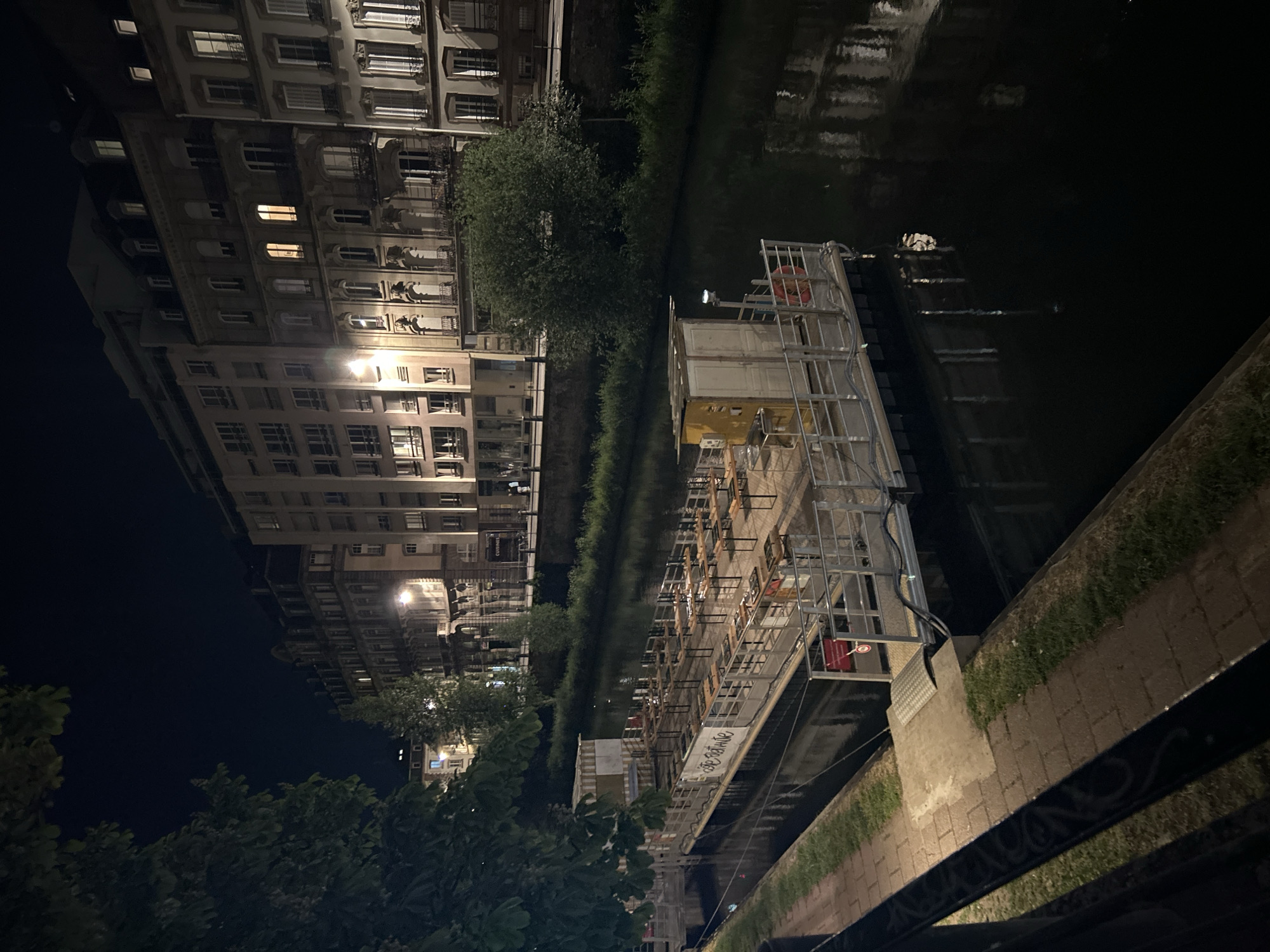 Evening stroll through illuminated Strasbourg captures canal reflections, hotels