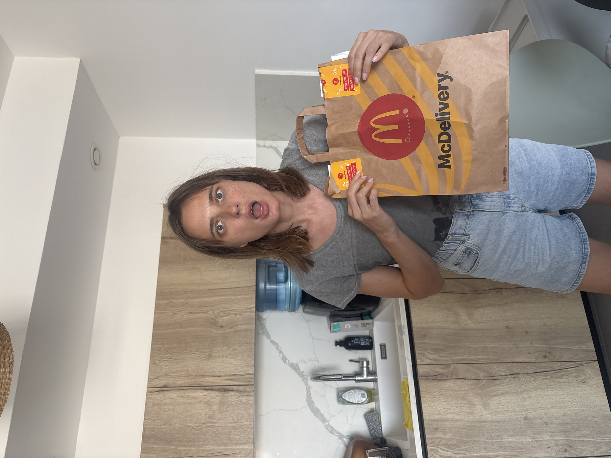 McDonald's delivery unpacked and eaten in a Tel Aviv kitchen