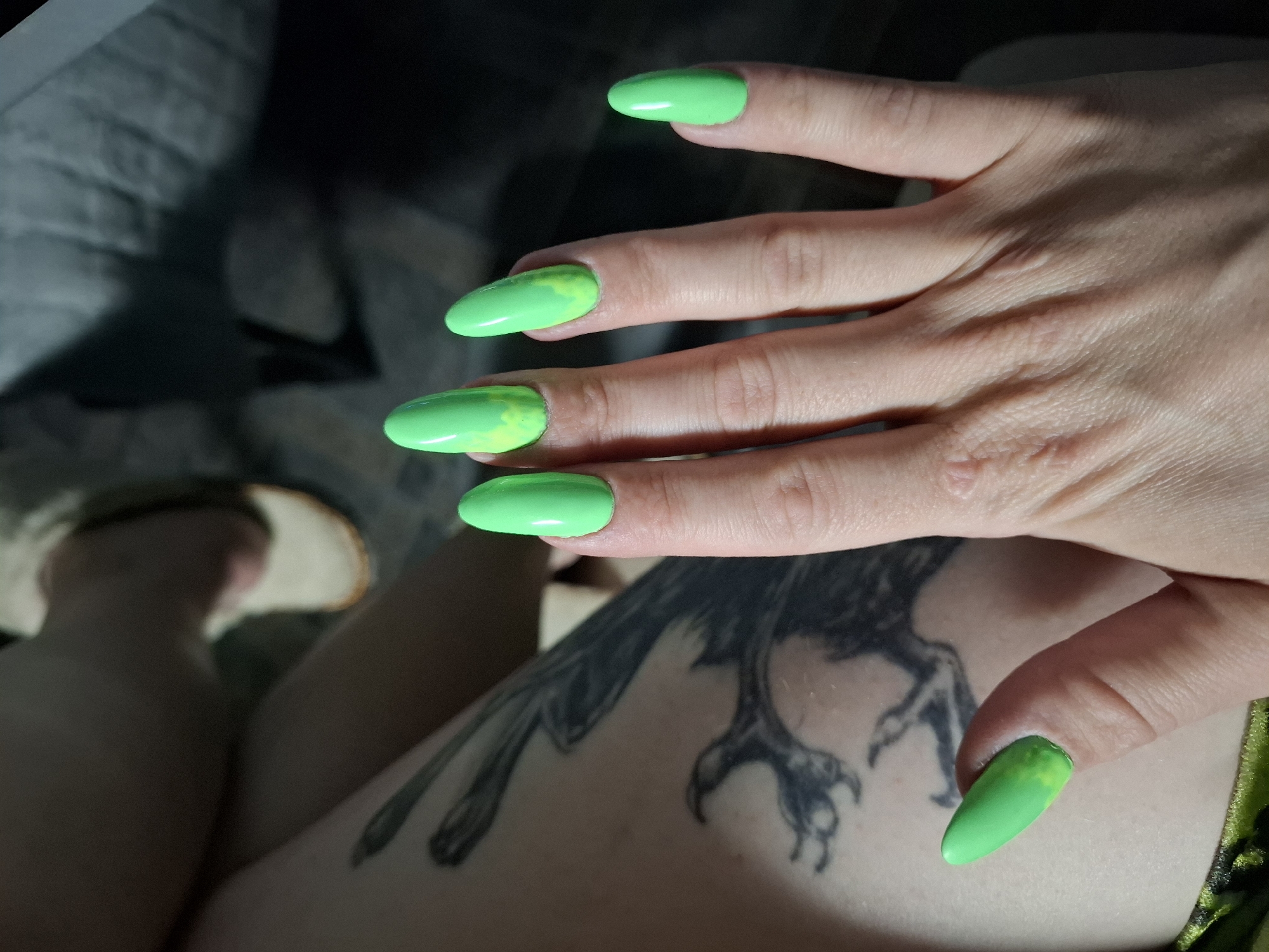 Green nail art with yellow accents spotted in Novi Sad