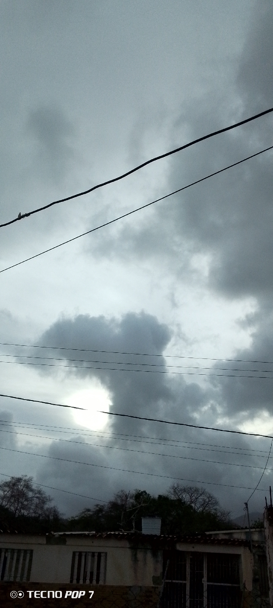 Storm clouds gather over Altagracia, Venezuela residential area