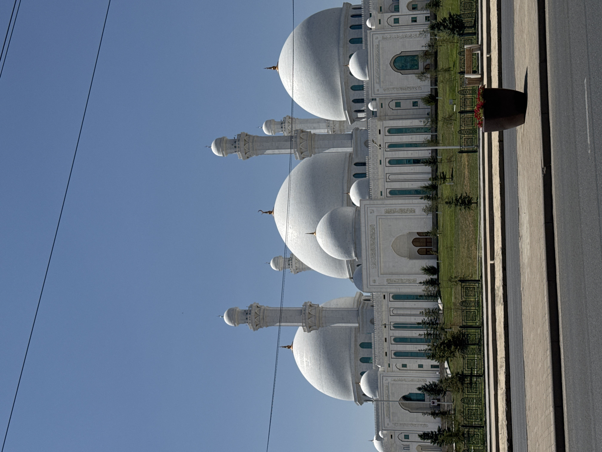 Grand white mosque with ornate domes in Shymkent, Kazakhstan
