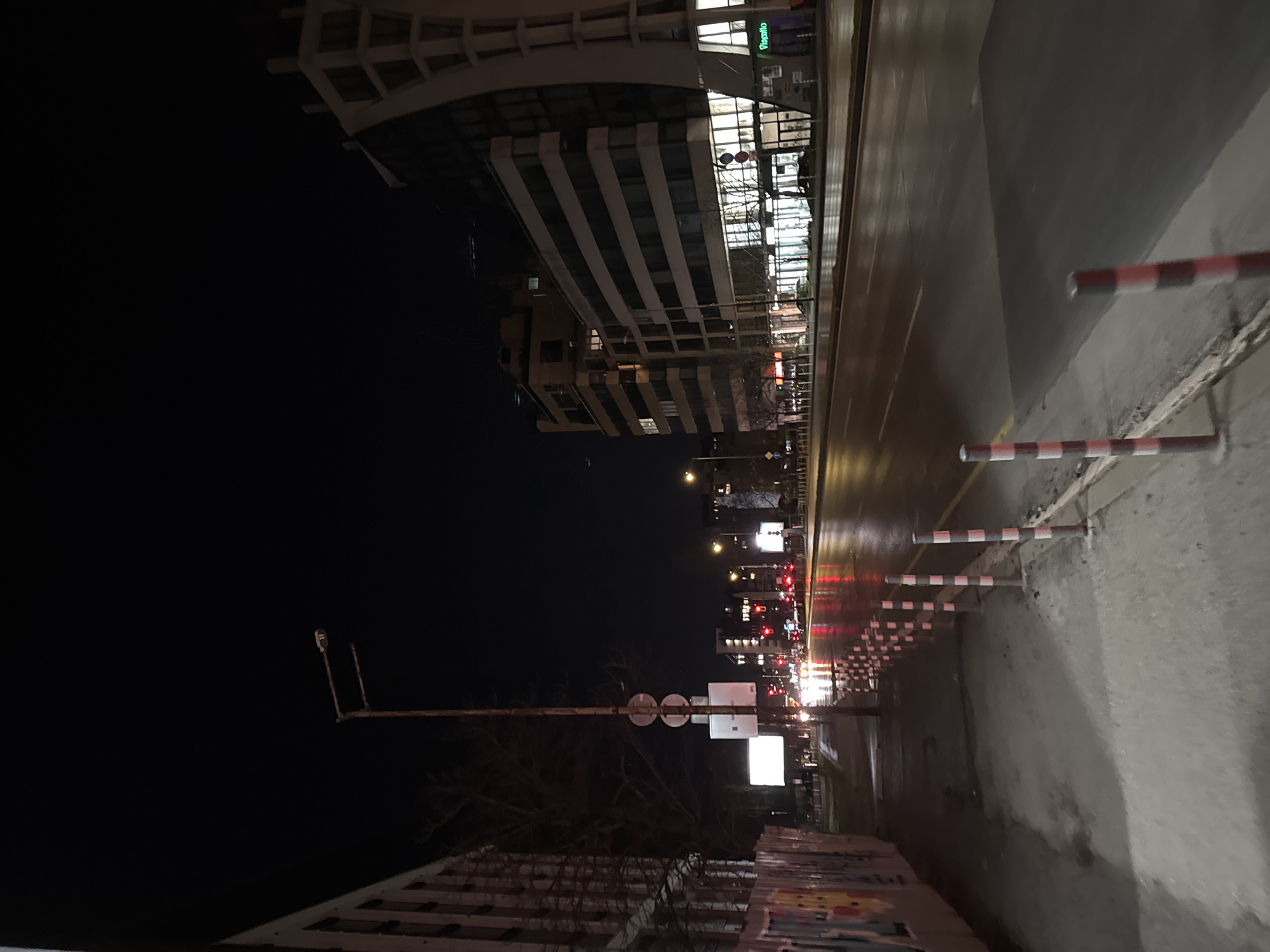 Wet nighttime street scene documented in Sofia, Bulgaria