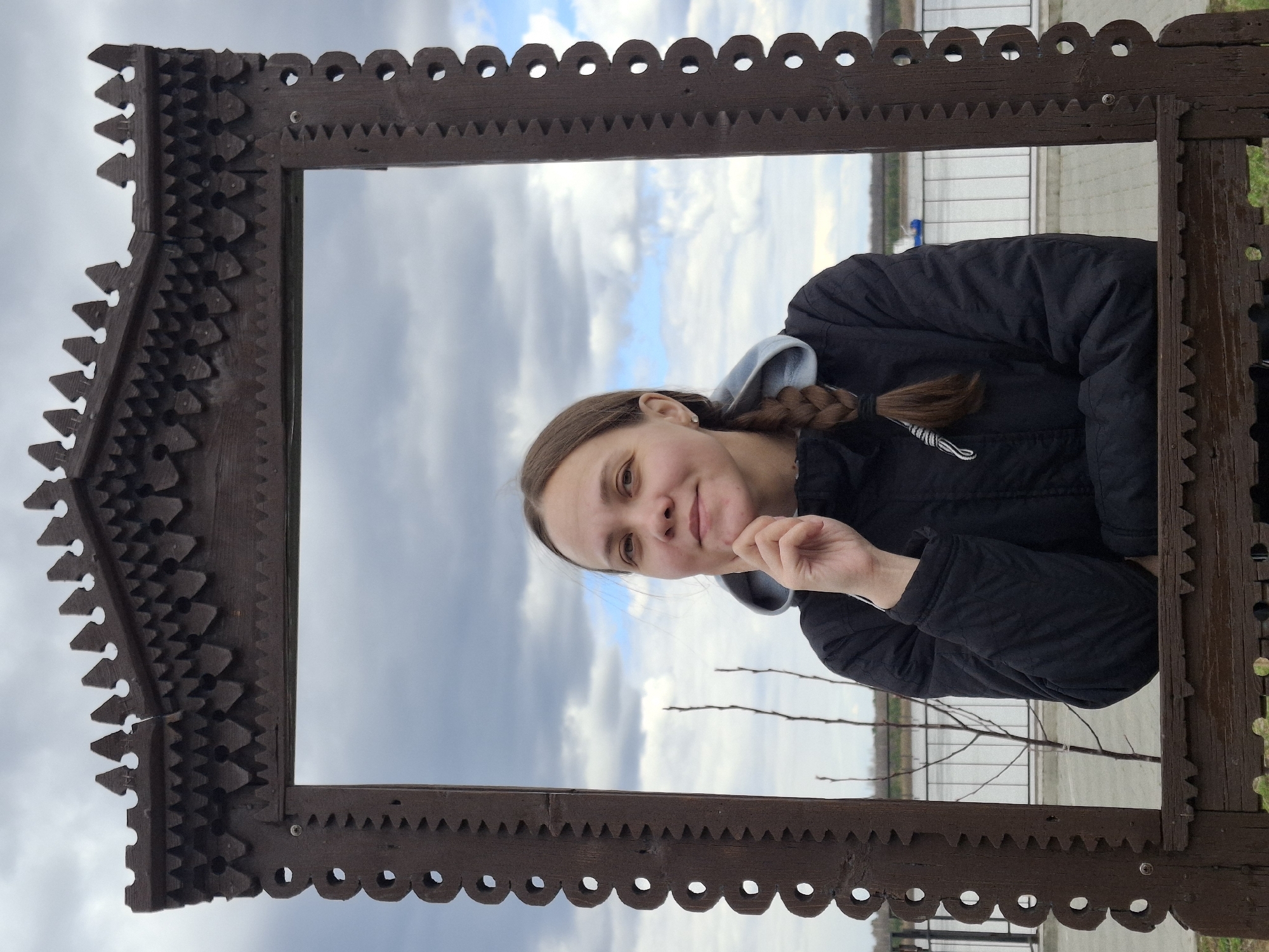 Tourist photographs young woman at Sarapul landmarks during morning visit