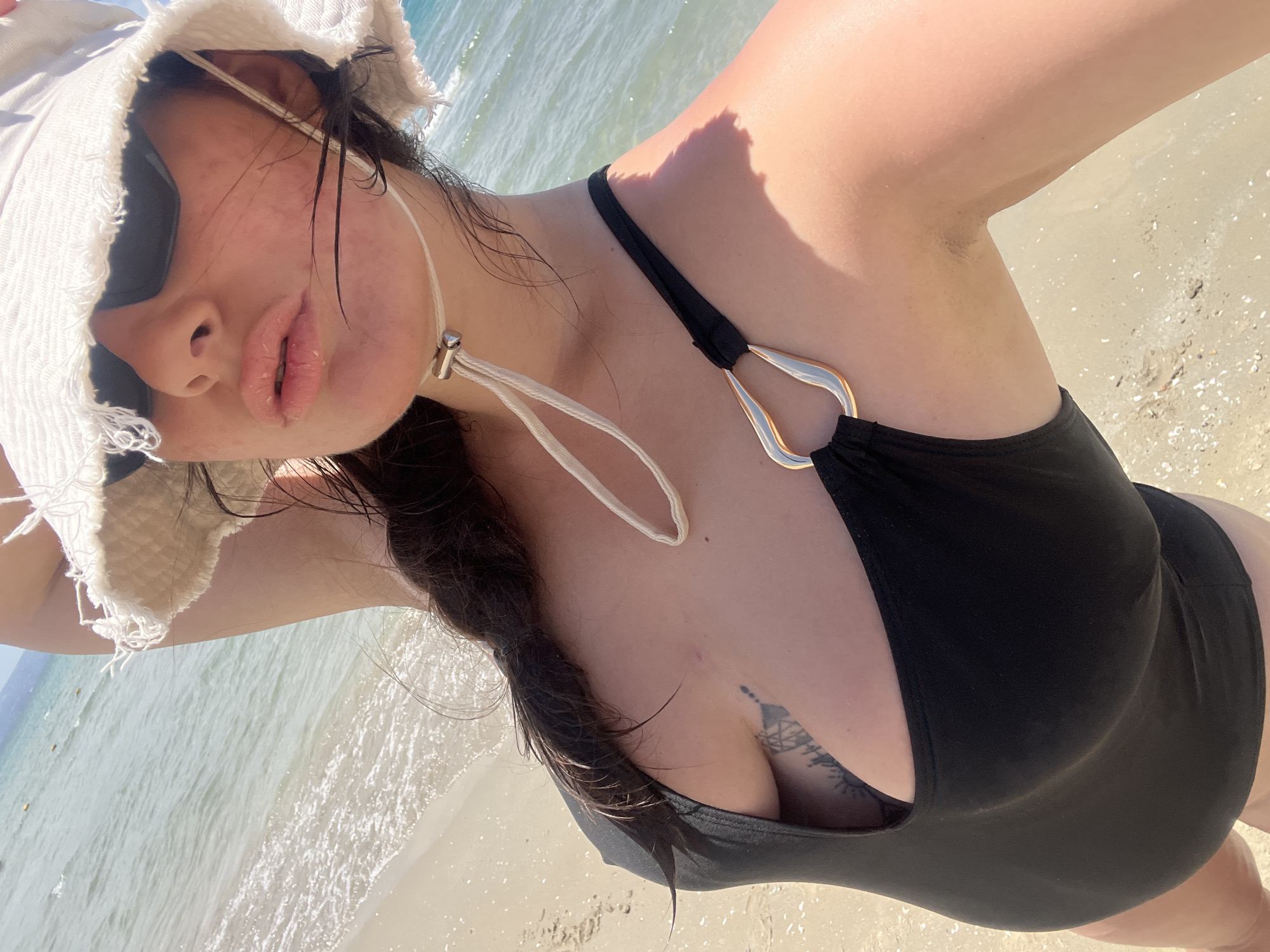 Woman enjoys sunny beach day in Acre, Israel