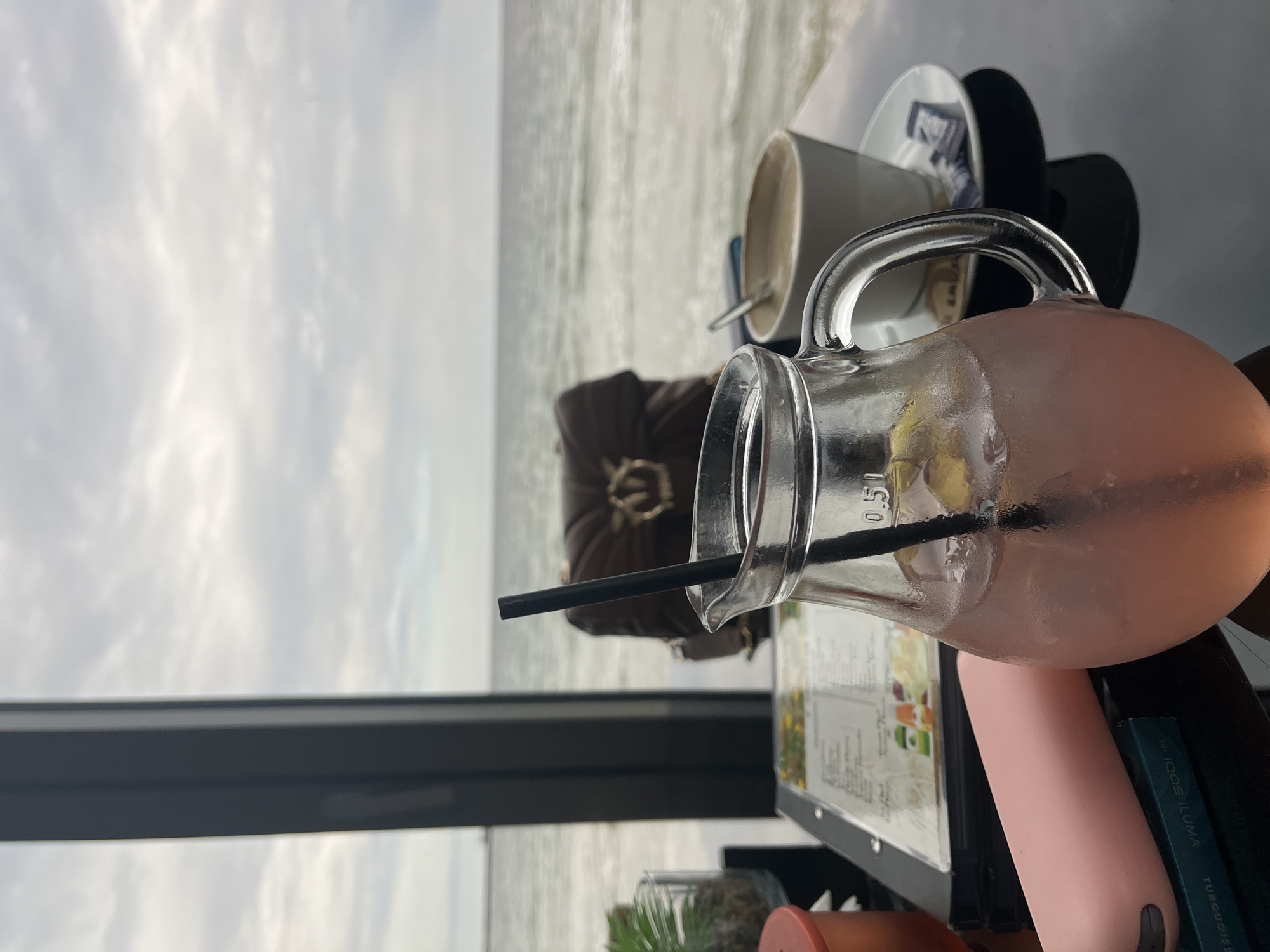 Man uses phone at seaside cafe in Varna