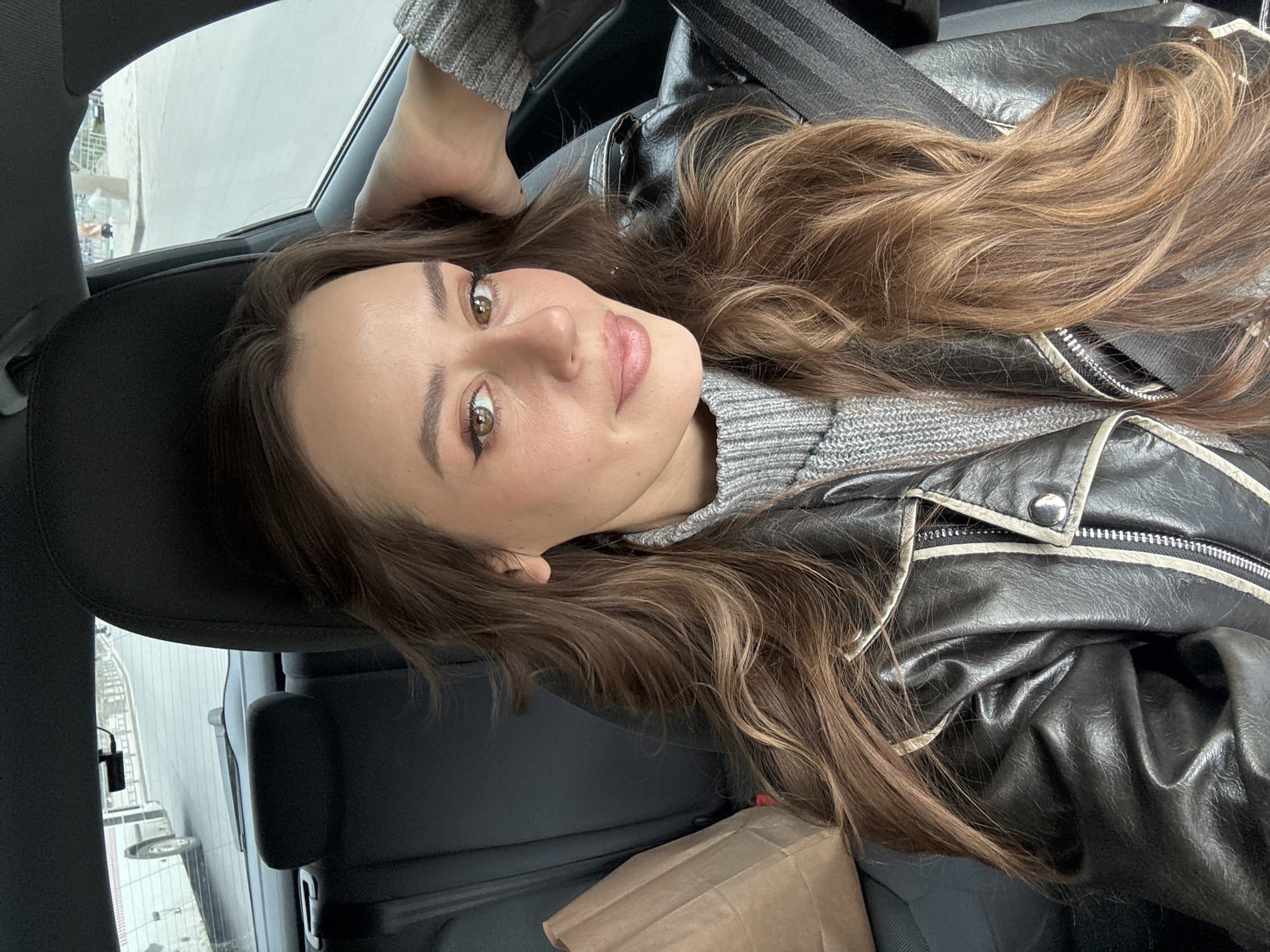 Woman takes selfie in parked car in Krasnoyarsk
