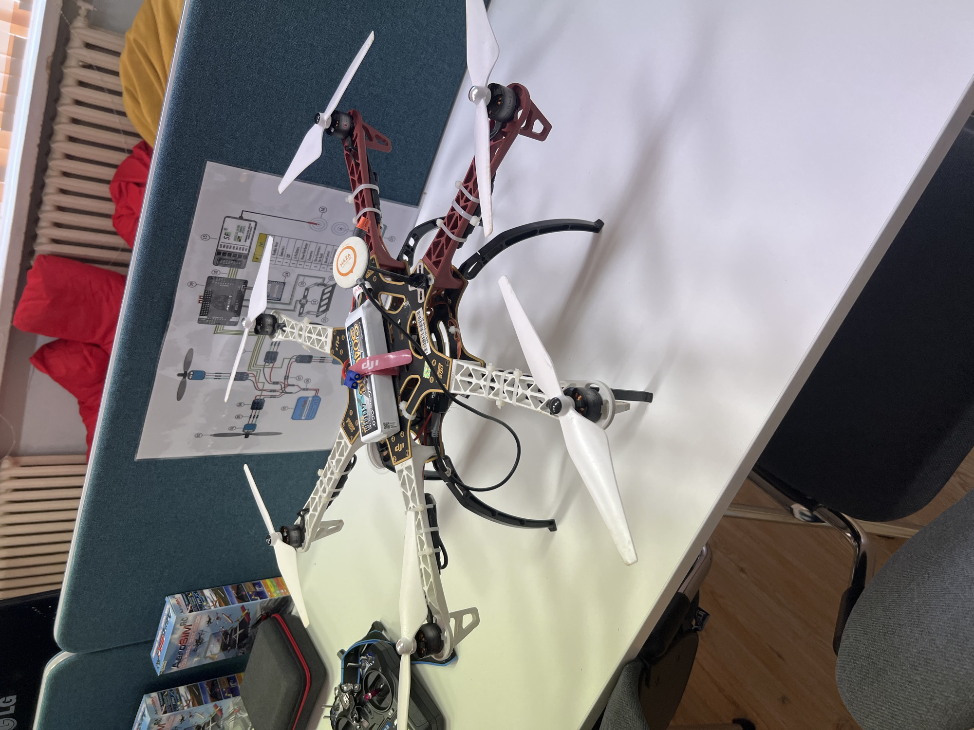 RC drone and airplane laid out on a table in Pravets