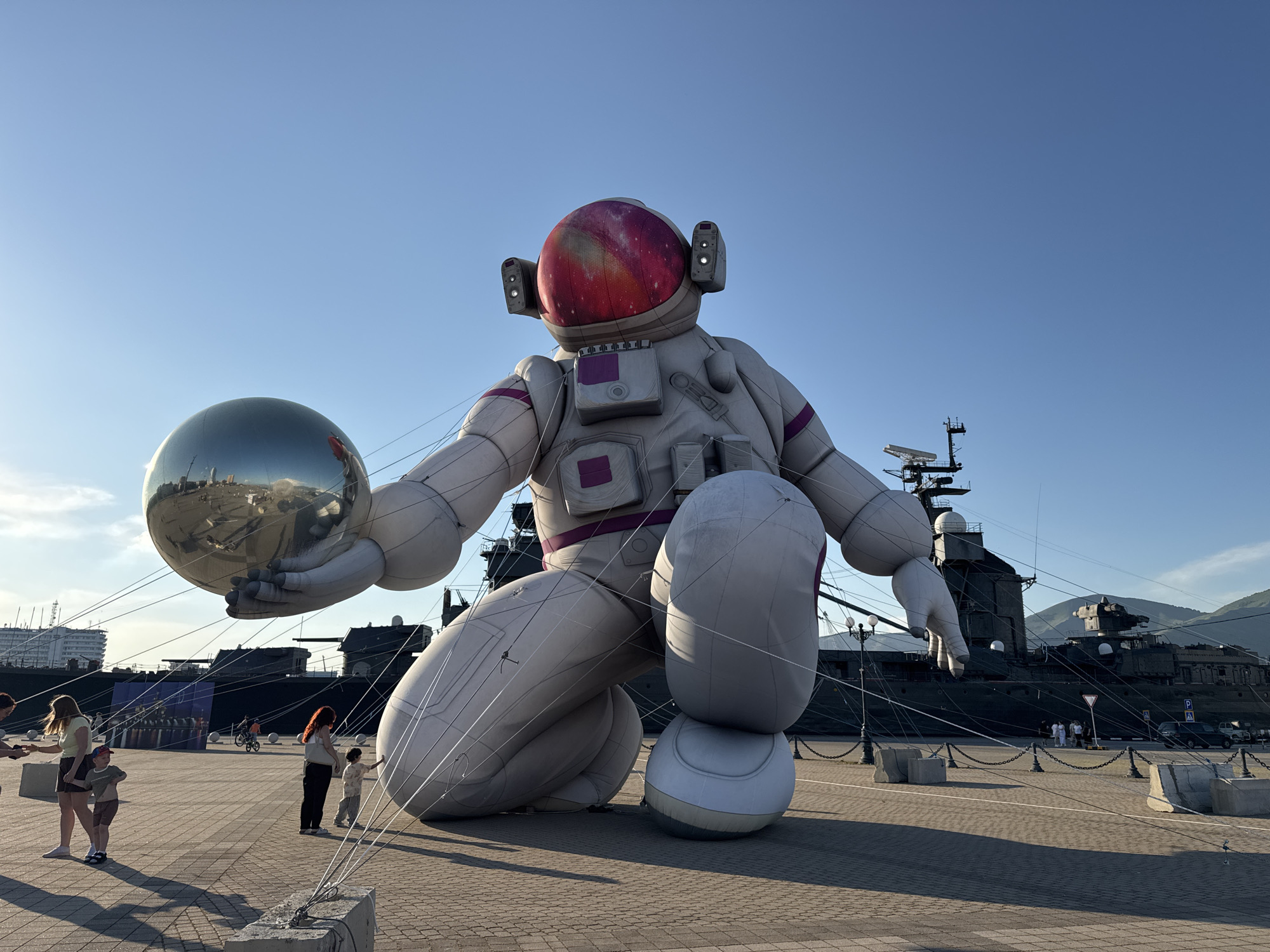 Giant astronaut sculpture, moon model displayed in Novorossiysk plaza