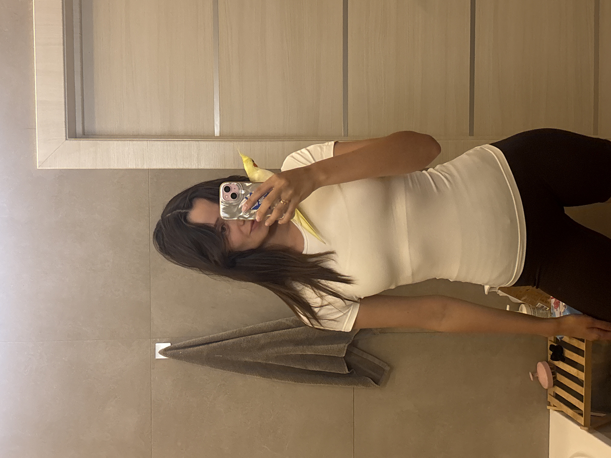 Mirror selfie with cockatiel companion in Krasnoyarsk bathroom