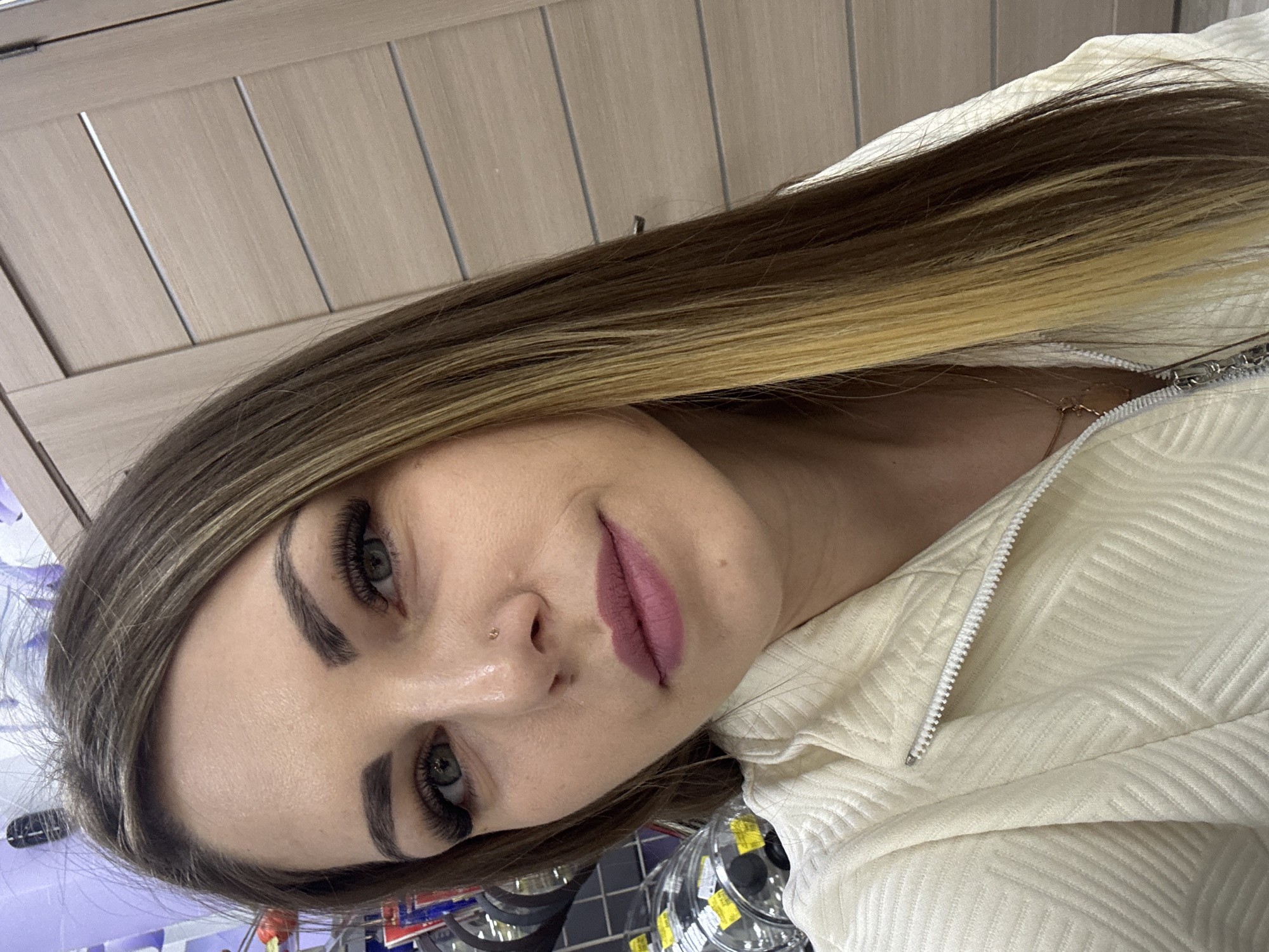 Woman takes selfies while shopping in Klin store