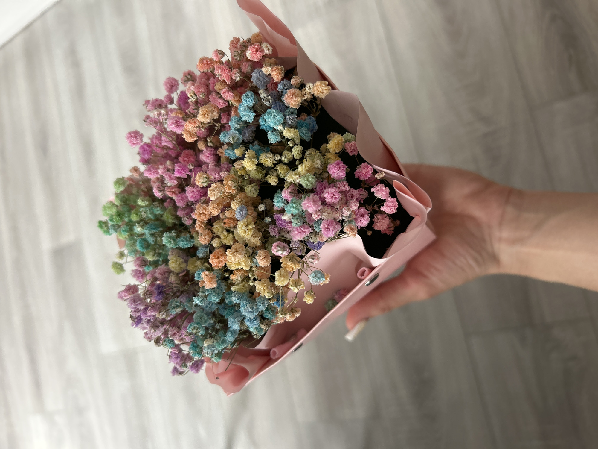 Indoor selfie session with heart shirt and flower bouquet