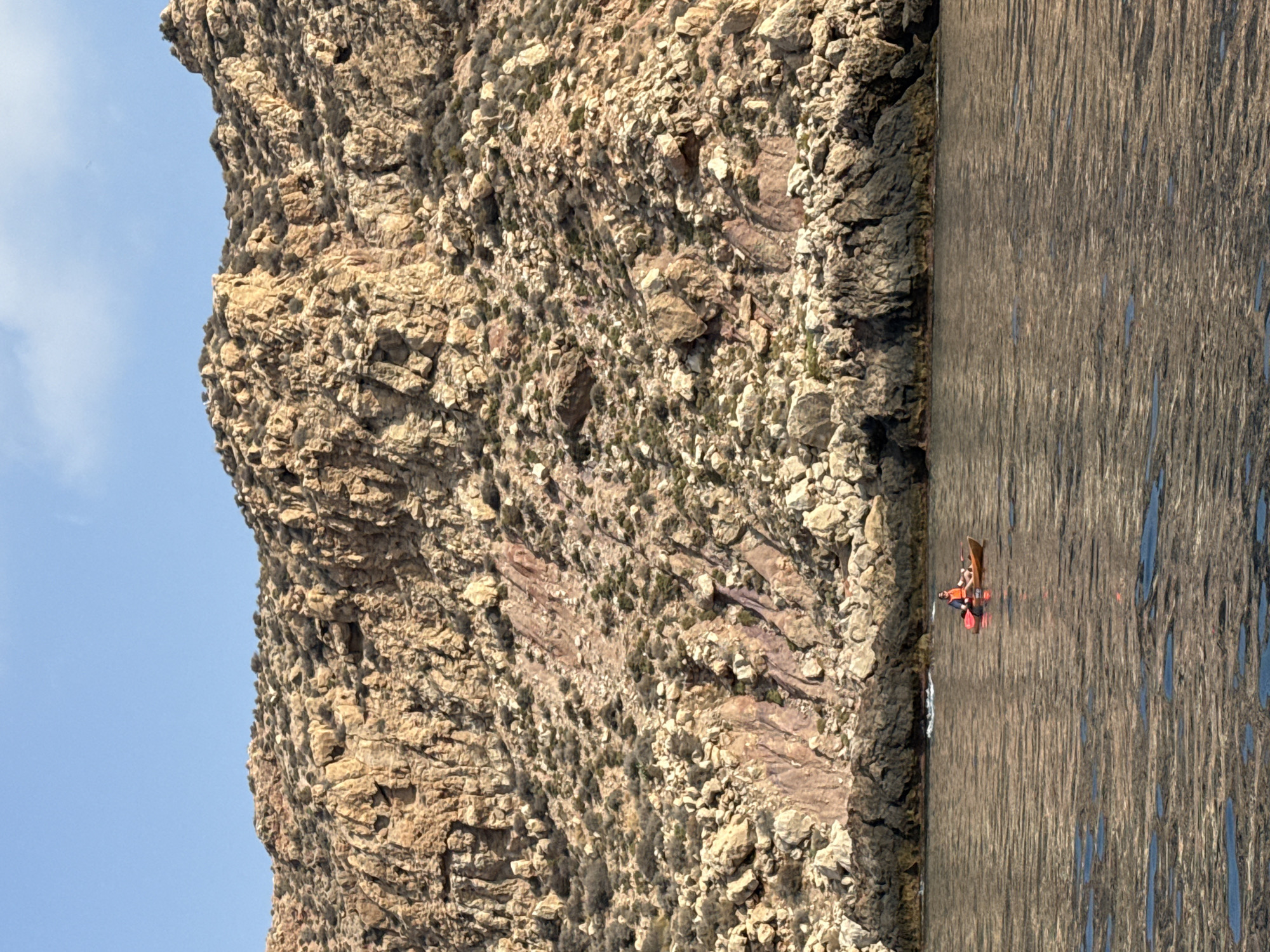 Rugged Spanish coastline cliffs with striking mineral vein exposed