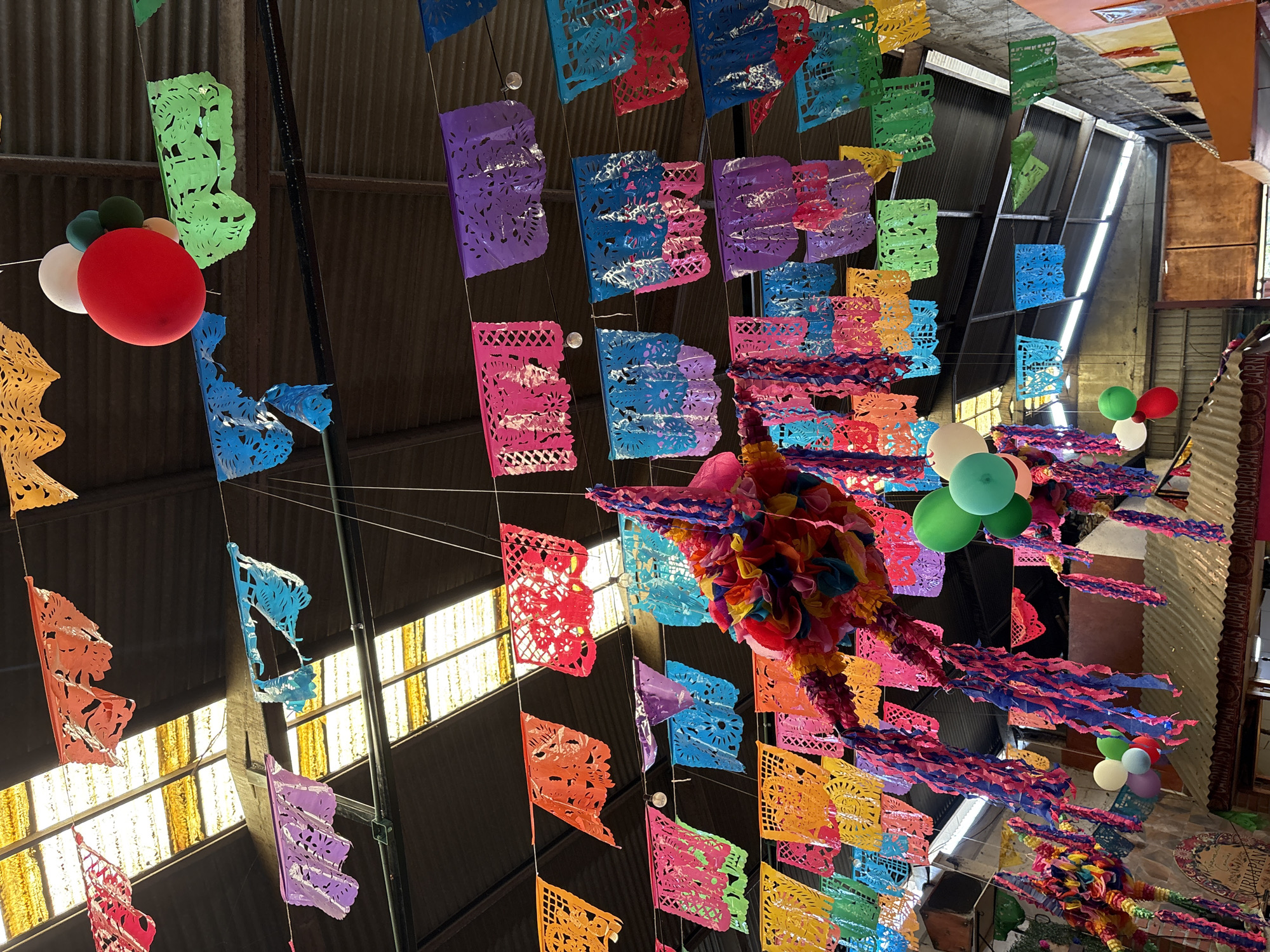 Traditional Mexican celebration with decorations, food, and live music