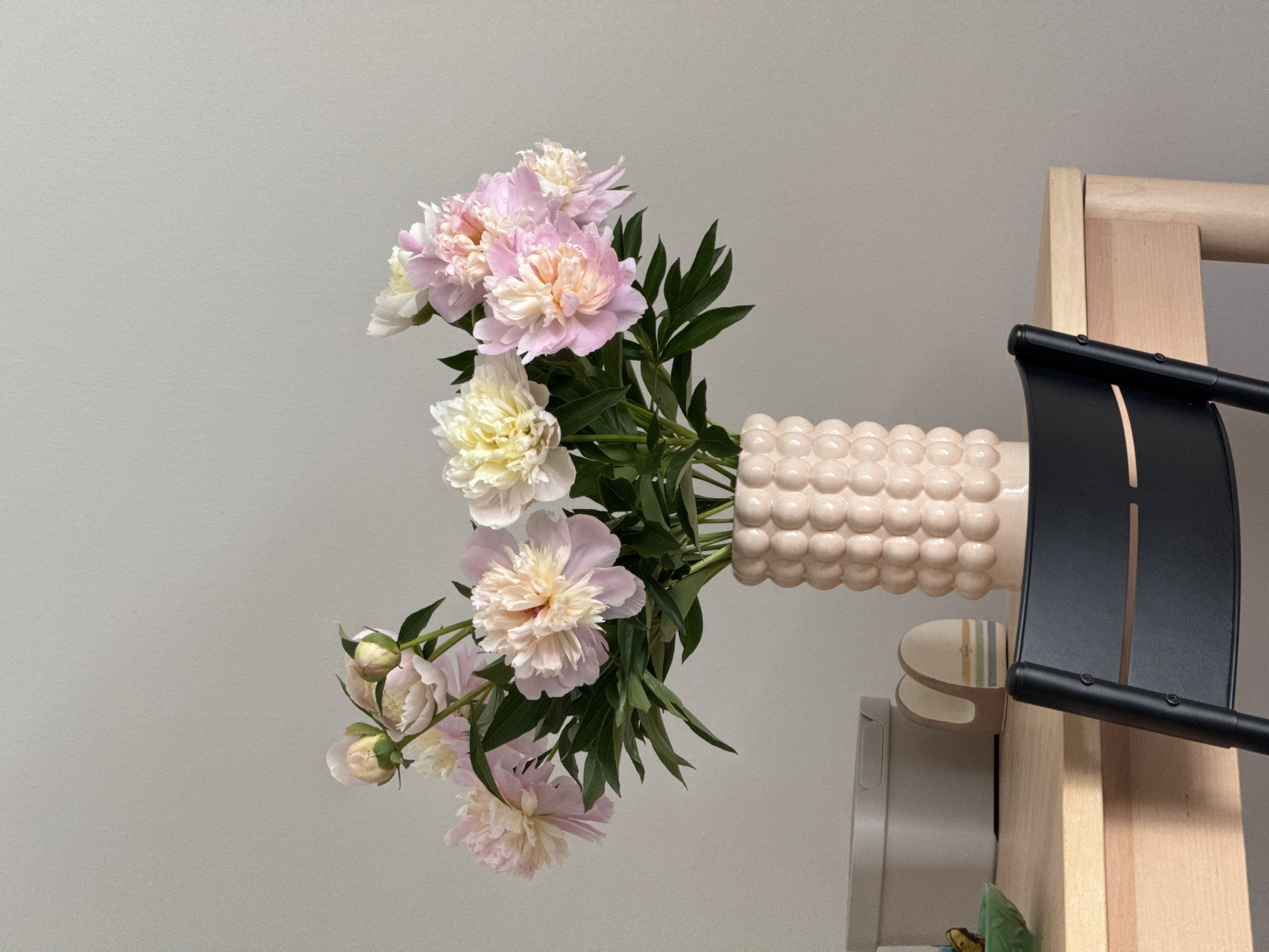 Peonies and a nautical desk calendar on a Russian tabletop