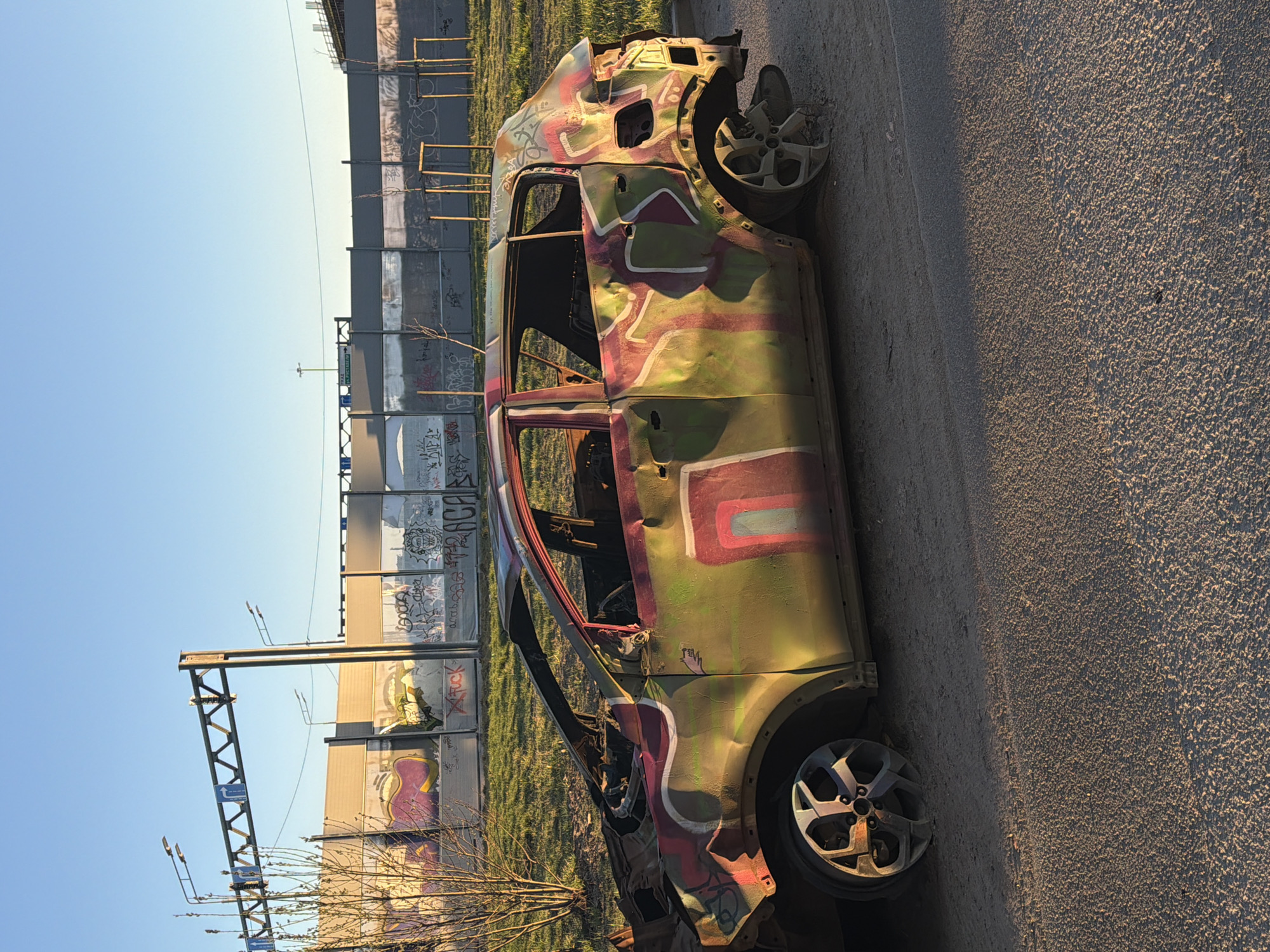 Damaged camouflage-painted car and graffiti spotted in Murino