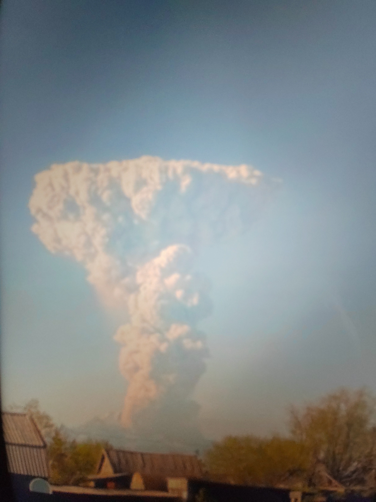 Volcanic ash plume rises over Petropavlovsk-Kamchatsky amid urban decay