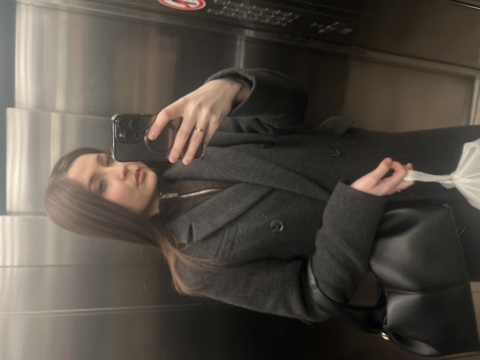 Woman takes mirror selfies in Khimki elevator