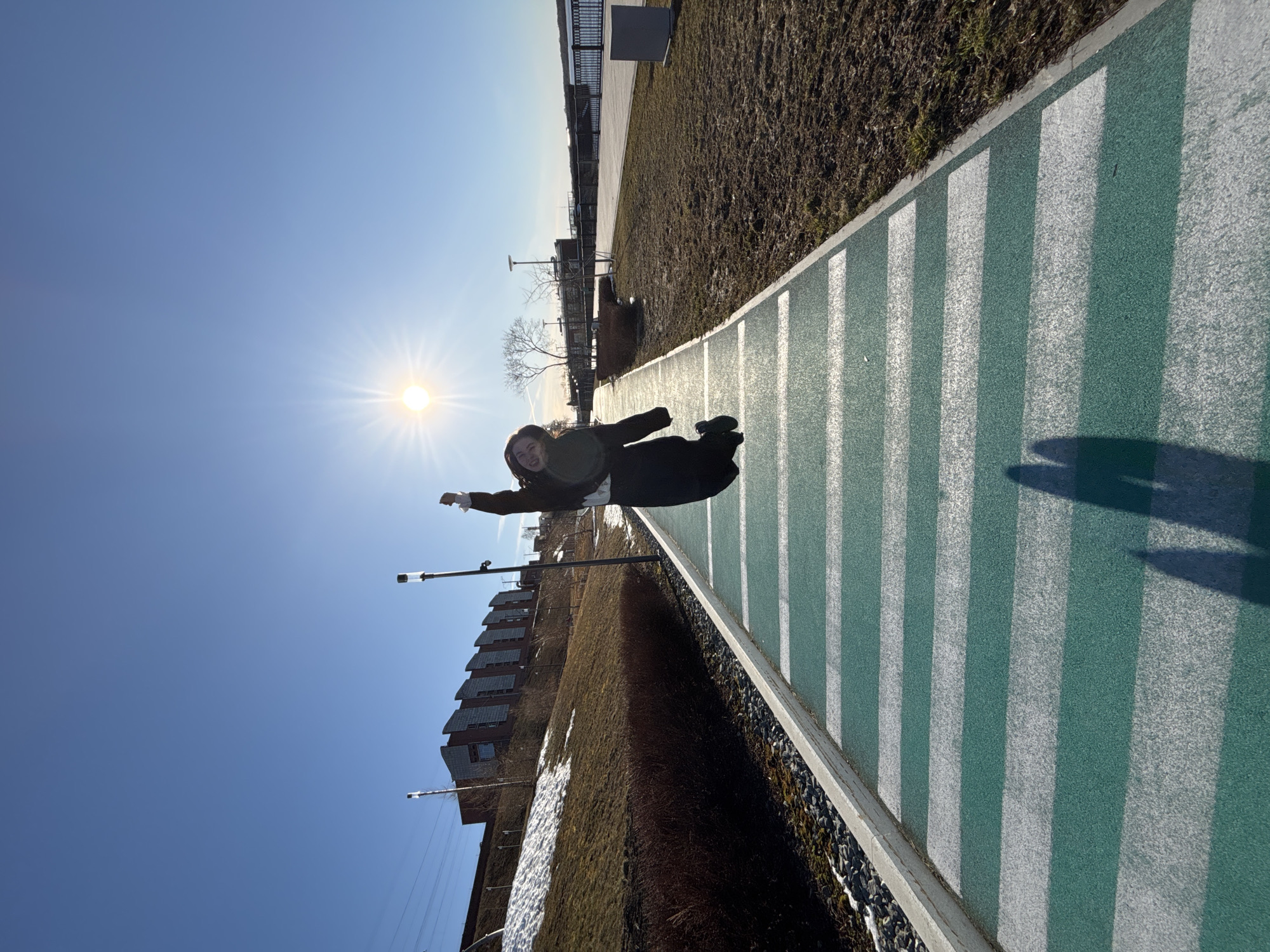 Person jumps or falls on striped path in Perm