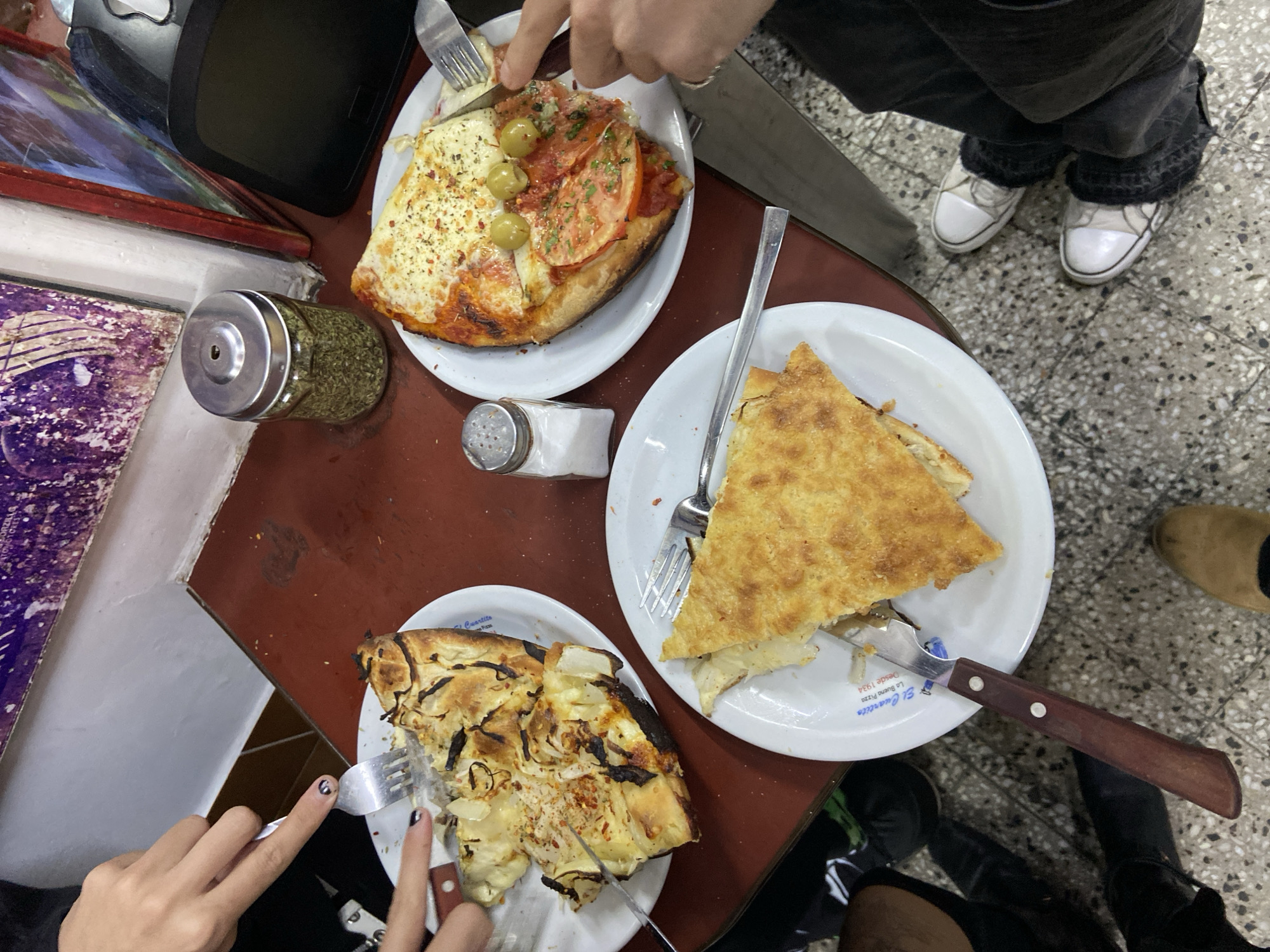 Late night dining at Buenos Aires pizzeria with Maradona memorabilia
