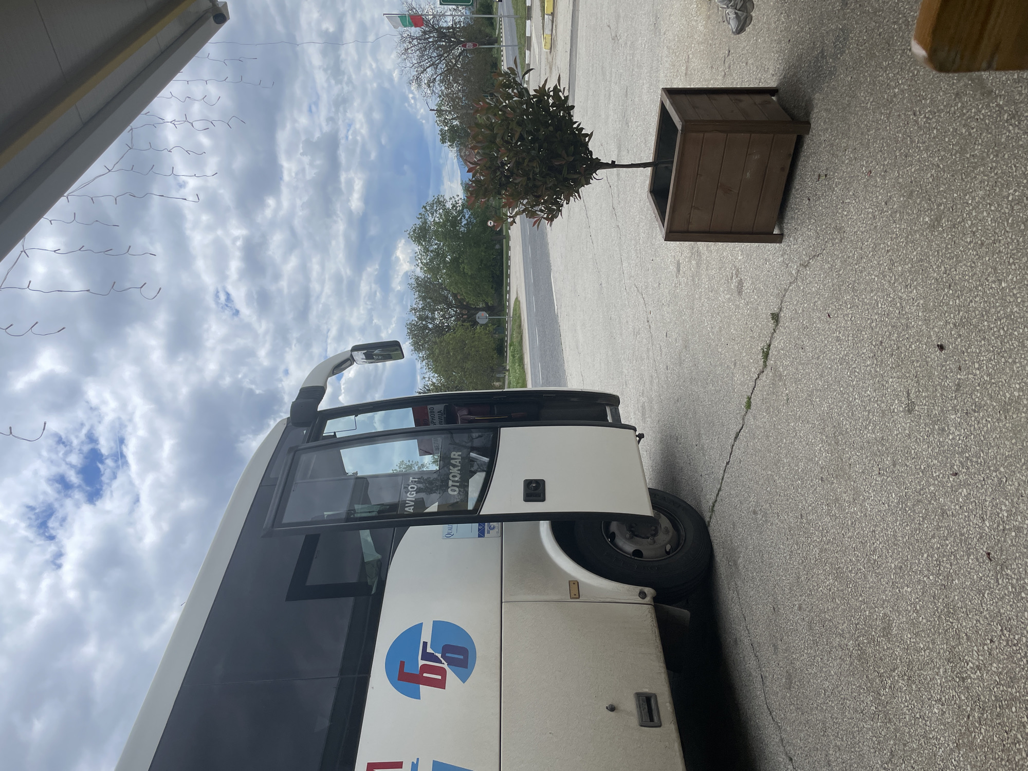 Bus parks near restaurant in Bulgarian town square